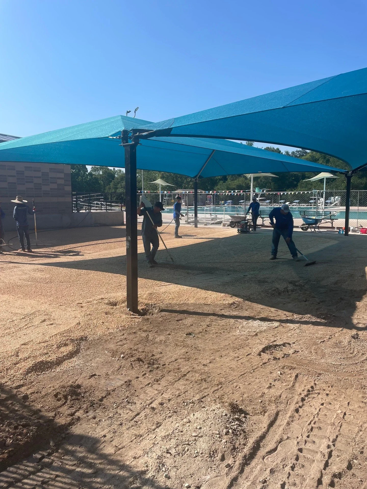 When we say &ldquo;all 🙌🏻 on deck,&rdquo; we mean it.
Our crew is rolling, raking, and sweating it out to prep the shade area for something way better than crunchy grass and bare dirt.