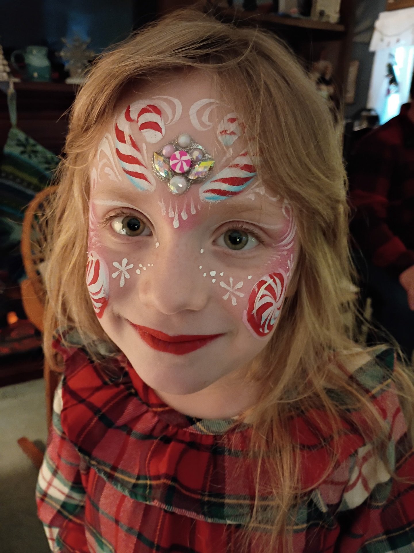 When your aunt is a face painter and you&rsquo;re the only kid getting painted, you get the deluxe treatment 😆🍭🎄

#christmasfacepaint #candycane