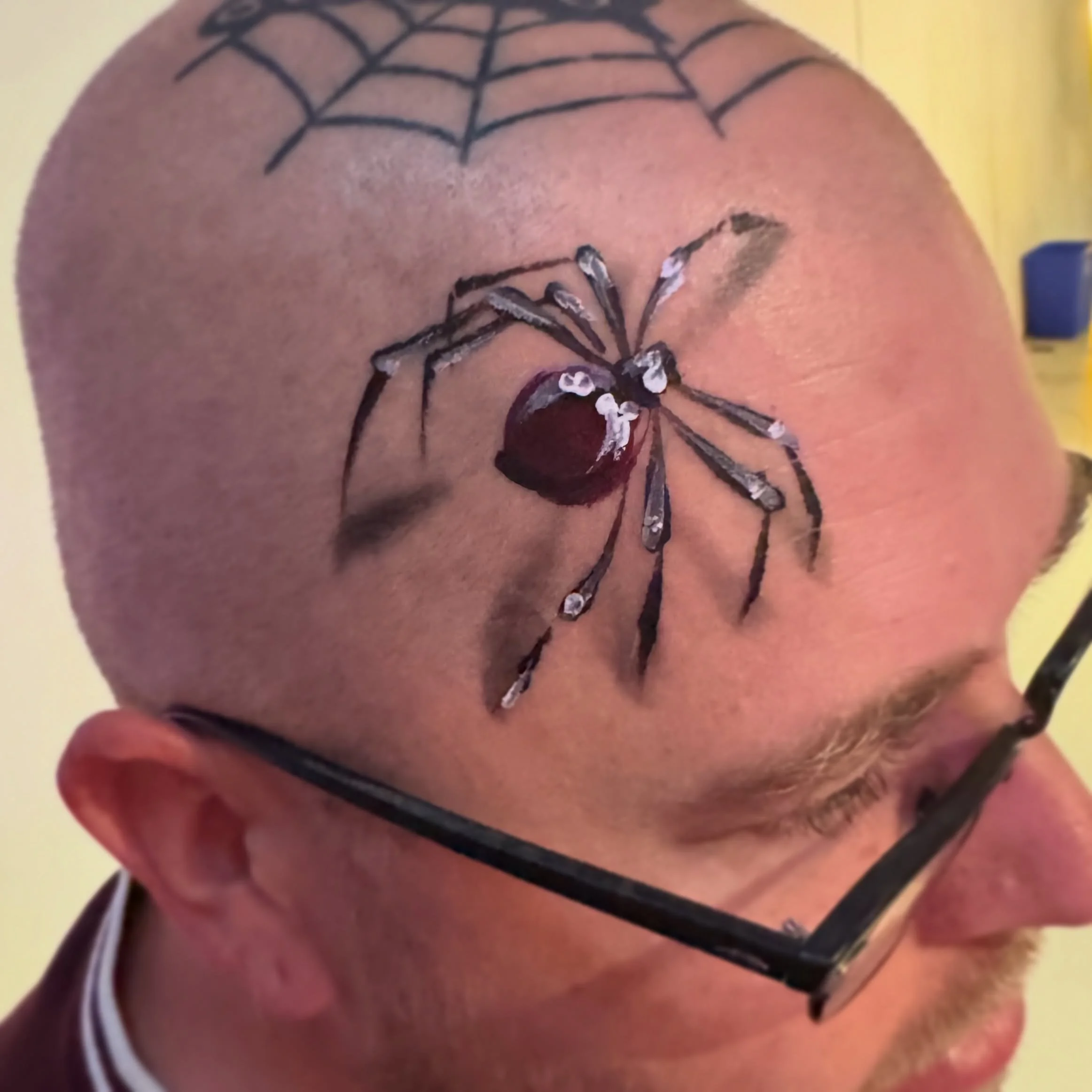 When a bald man wands a spider on his head, you paint a spider on his head. 🕷️🕸️