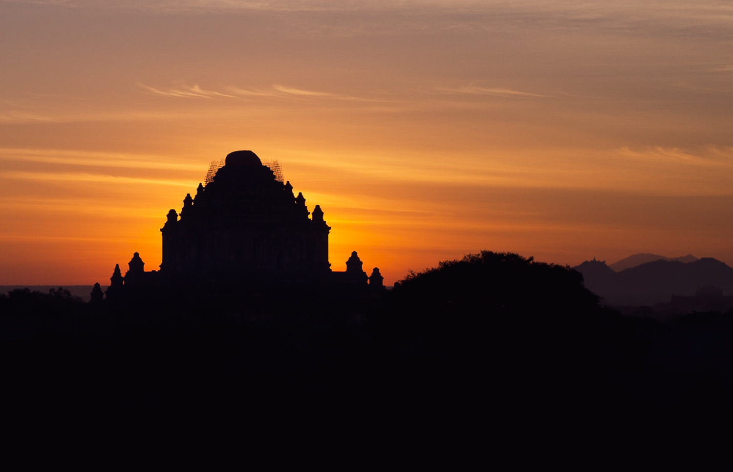 Bagan Sunrise: Sun behind Sulamani Temple silhouette.