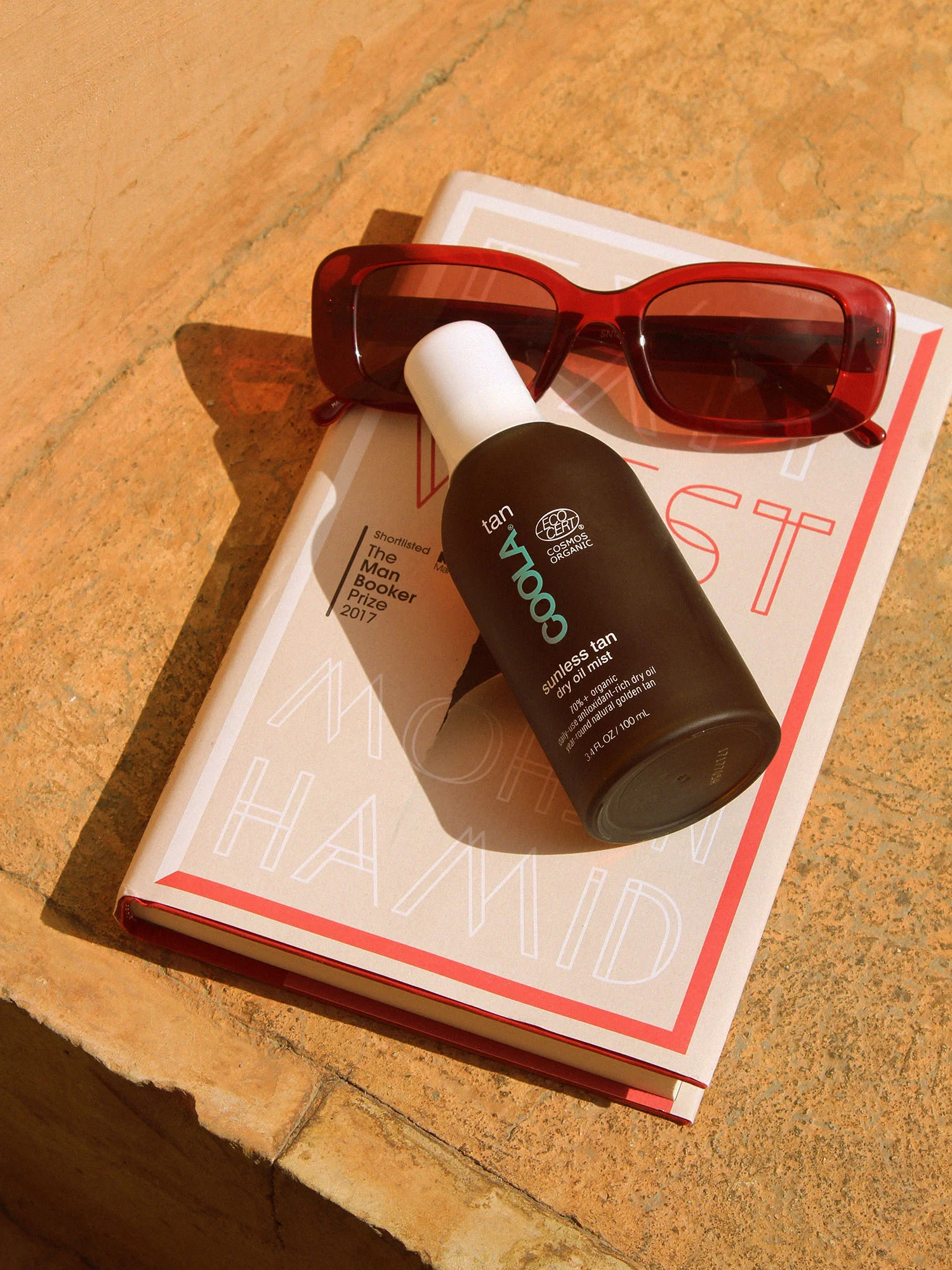 coola tan komono sunglasses exit west.jpg