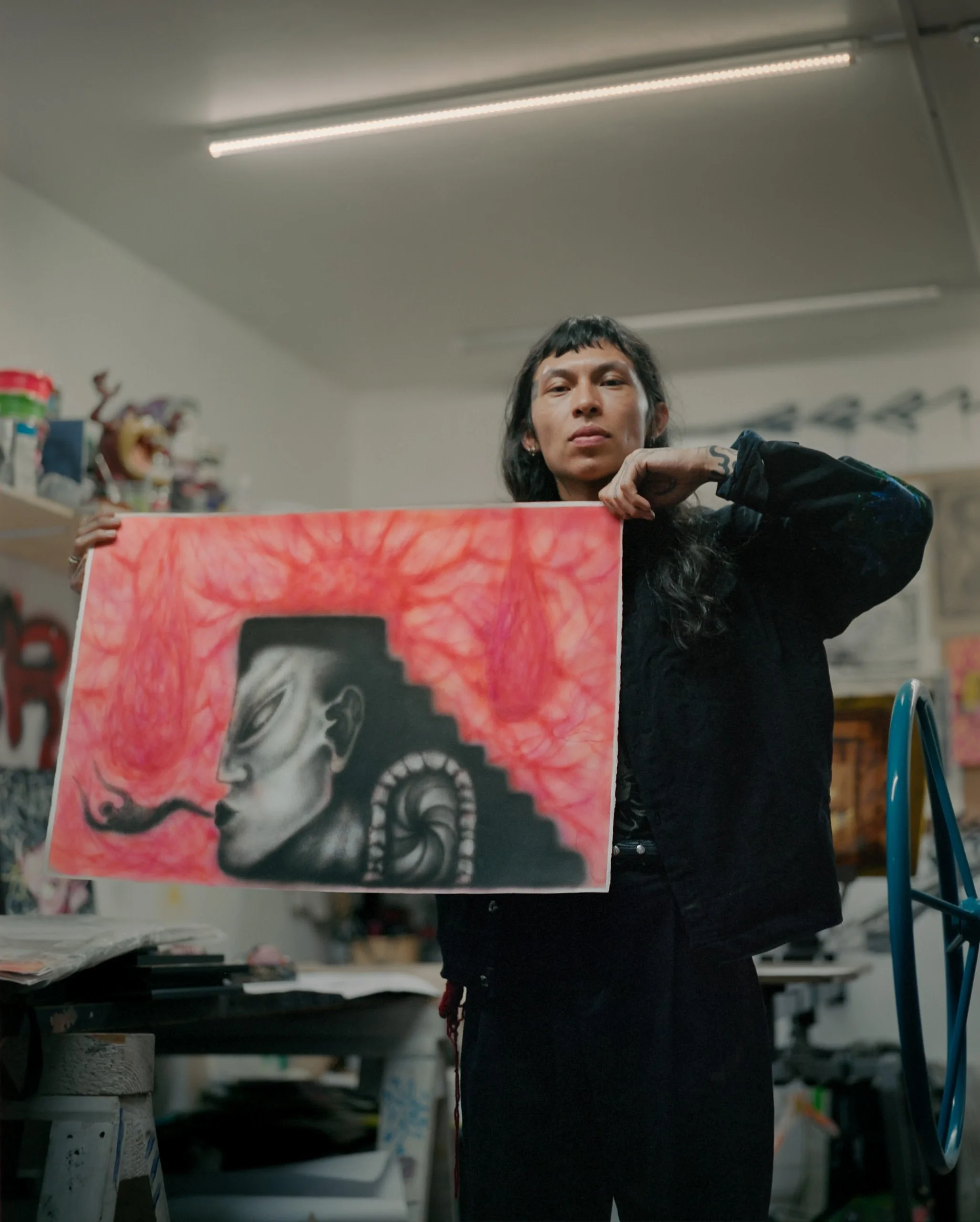 a-caged-dog-barks-the-fiercest-mexico-city-2024-studio-portrait-holding-artwork-ryan-otoole-collett.jpeg