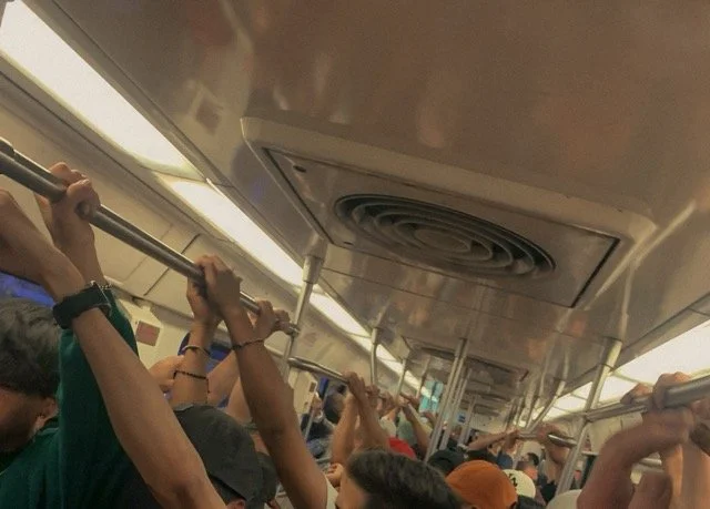 a-caged-dog-barks-the-fiercest-mexico-city-2024-metro-passengers-holding-rail-ryan-otoole-collett.jpeg