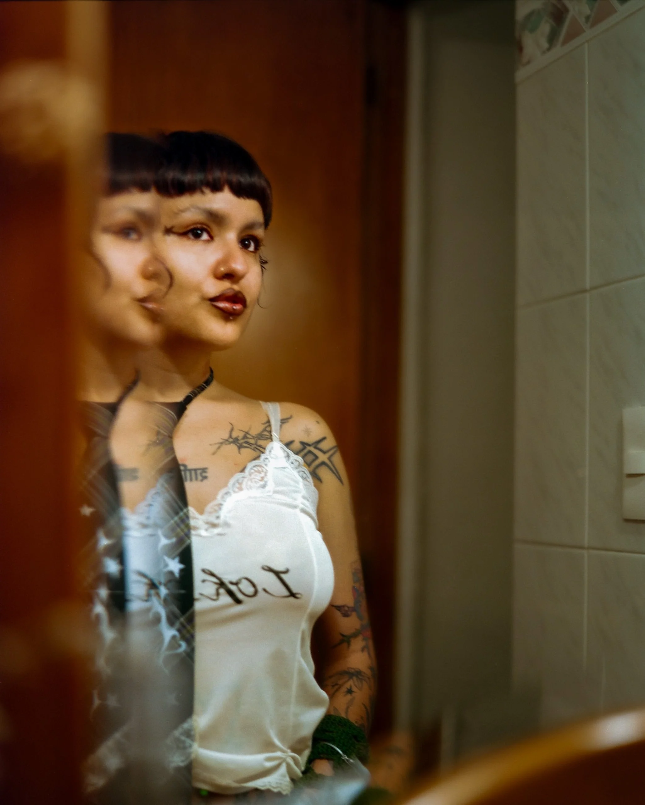Mirror portrait with a doubled face, from A Caged Dog Barks the Fiercest, Mexico City, 2024, by Ryan O’Toole Collett.