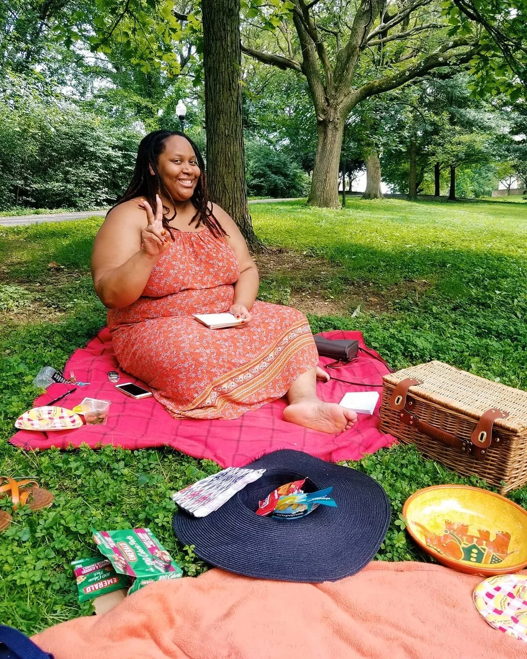  Collective member  Precious Blake  sitting in the park while we all sign thank you cards for the first members of our Patreon and enjoy a picnic together. 