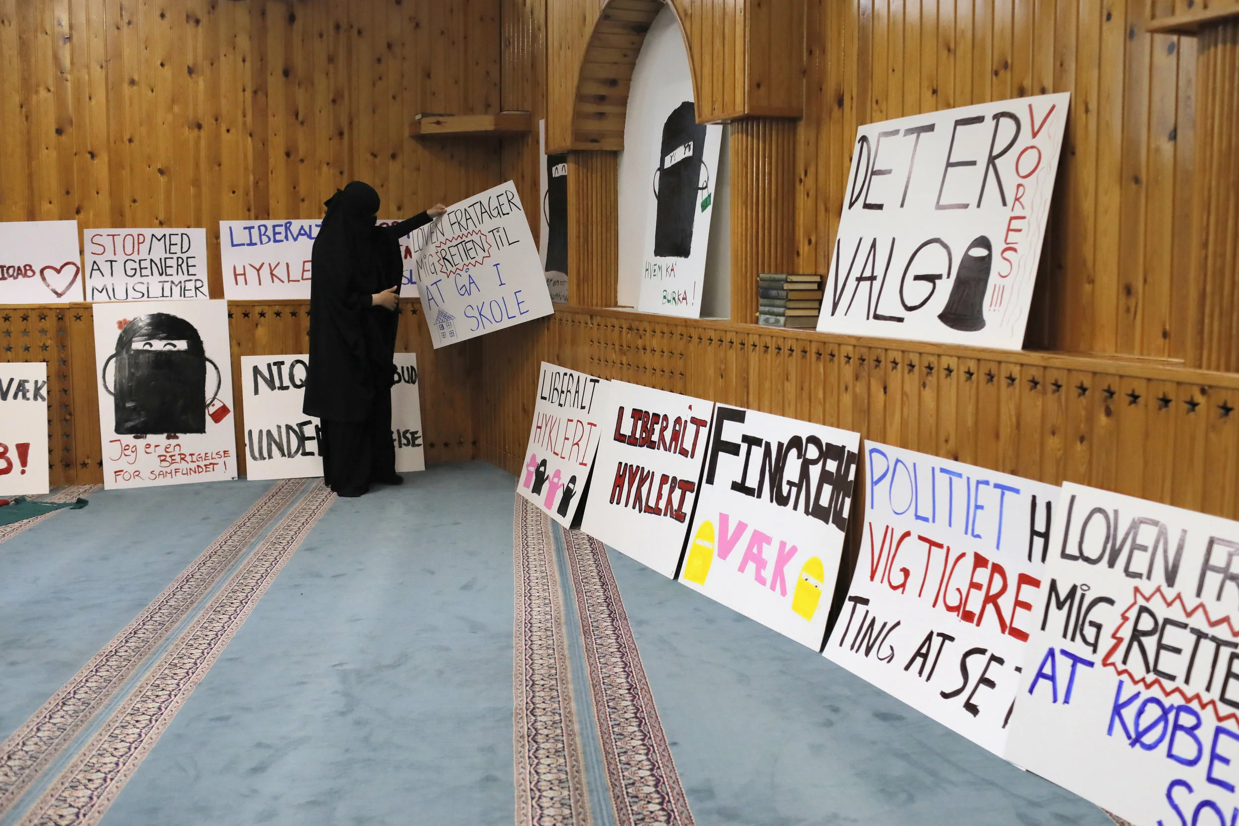  Mizgan places a hand painted sign against a wall to let it dry. Numerous workshops were held to prepare for the August 1 protest.  