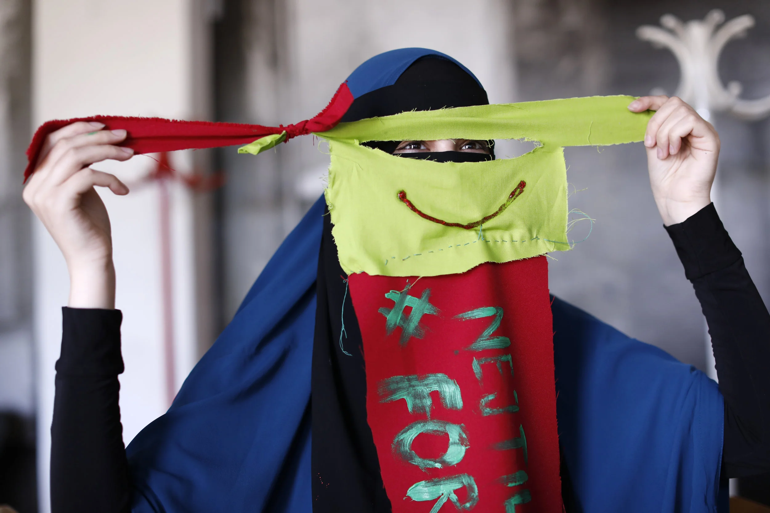  Alaa holds up a niqab she created to wear to a protest, organized to coincide with the August 1 ban on women in Denmark wearing niqabs.  