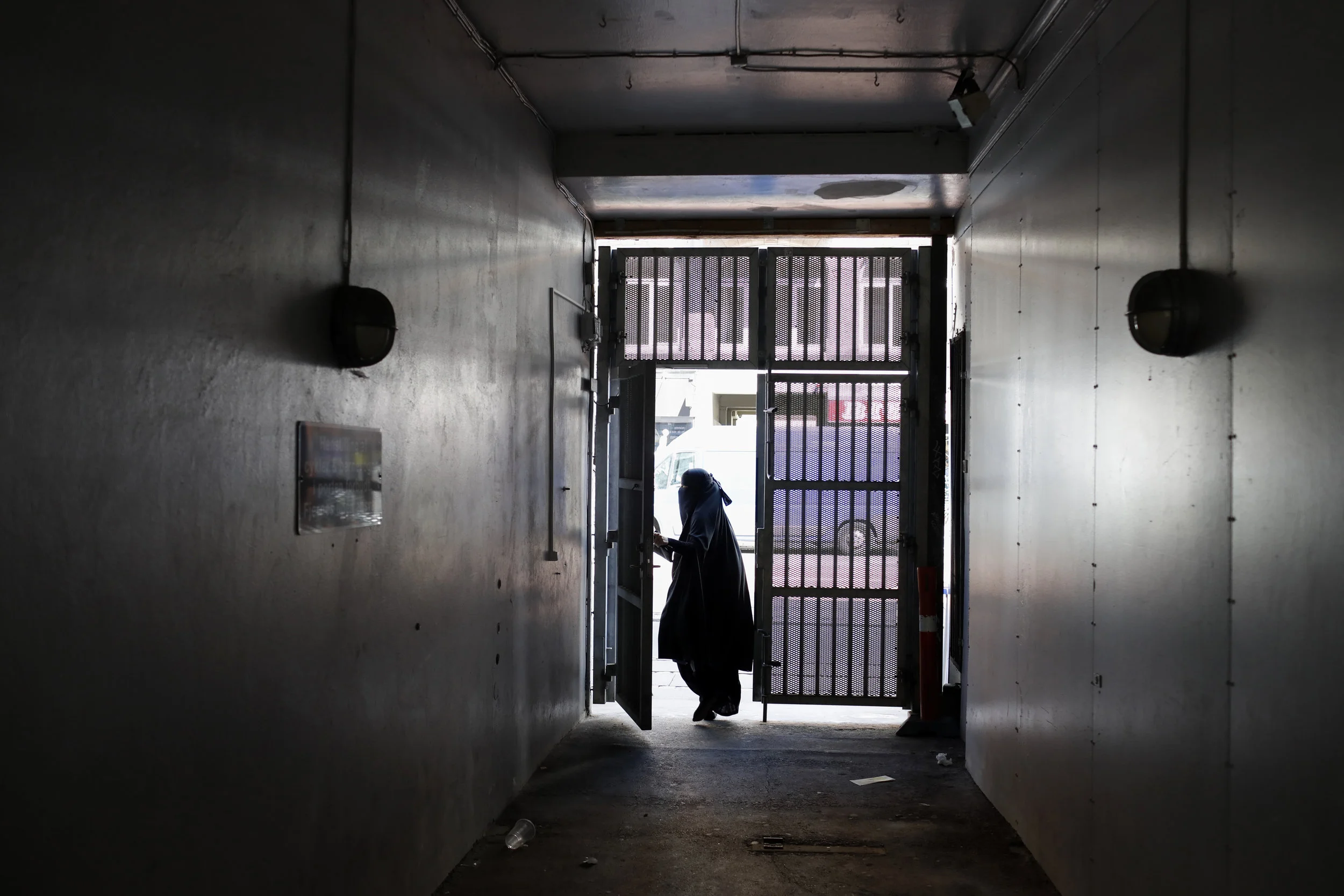  Ayah, 37, exits her building in Nørrebro. She is a western Dane and converted to Islam in her 20’s.  