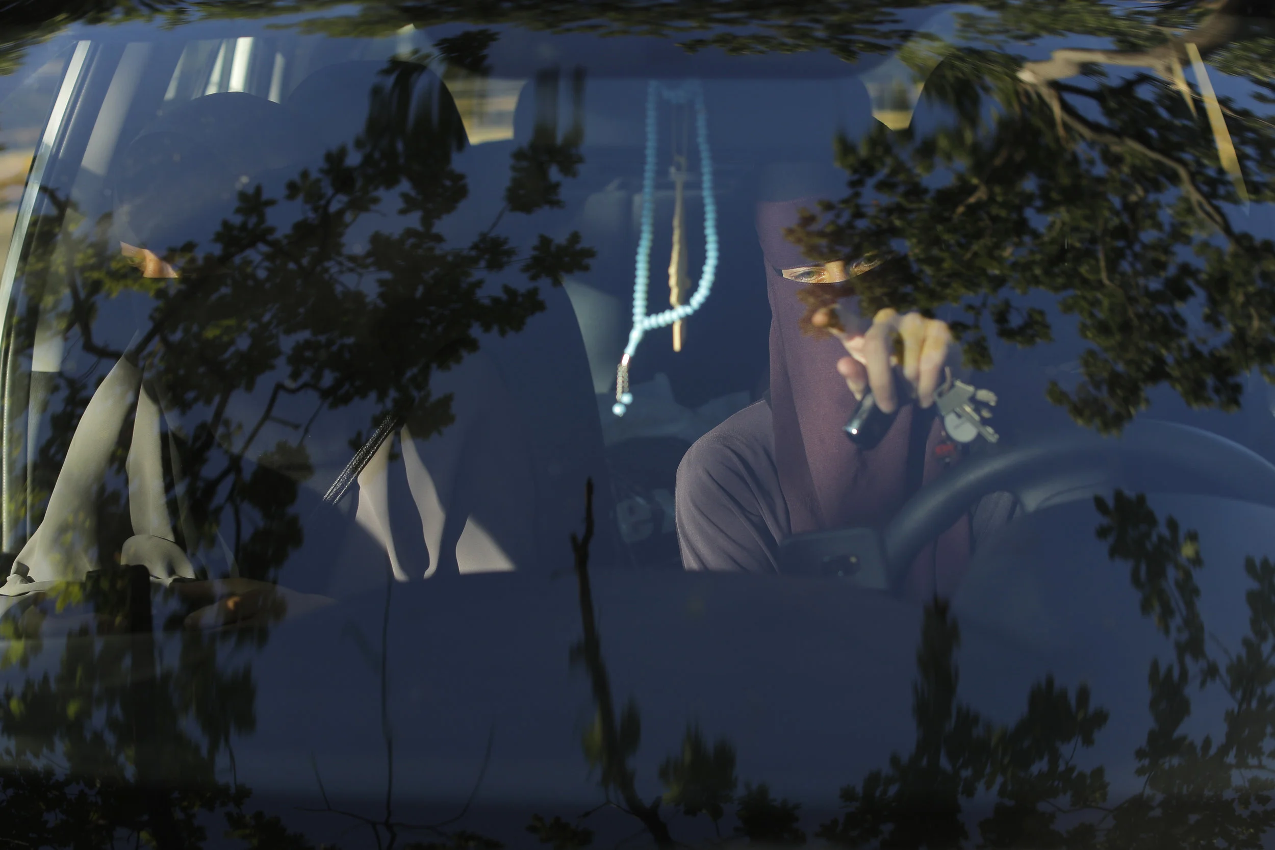  Sabina and Ayah prepare to drive in Copenhagen, Denmark. Once the ban passed, driving in your own car in a niqab is considered legal yet accessing it from a public area means breaking the law.  