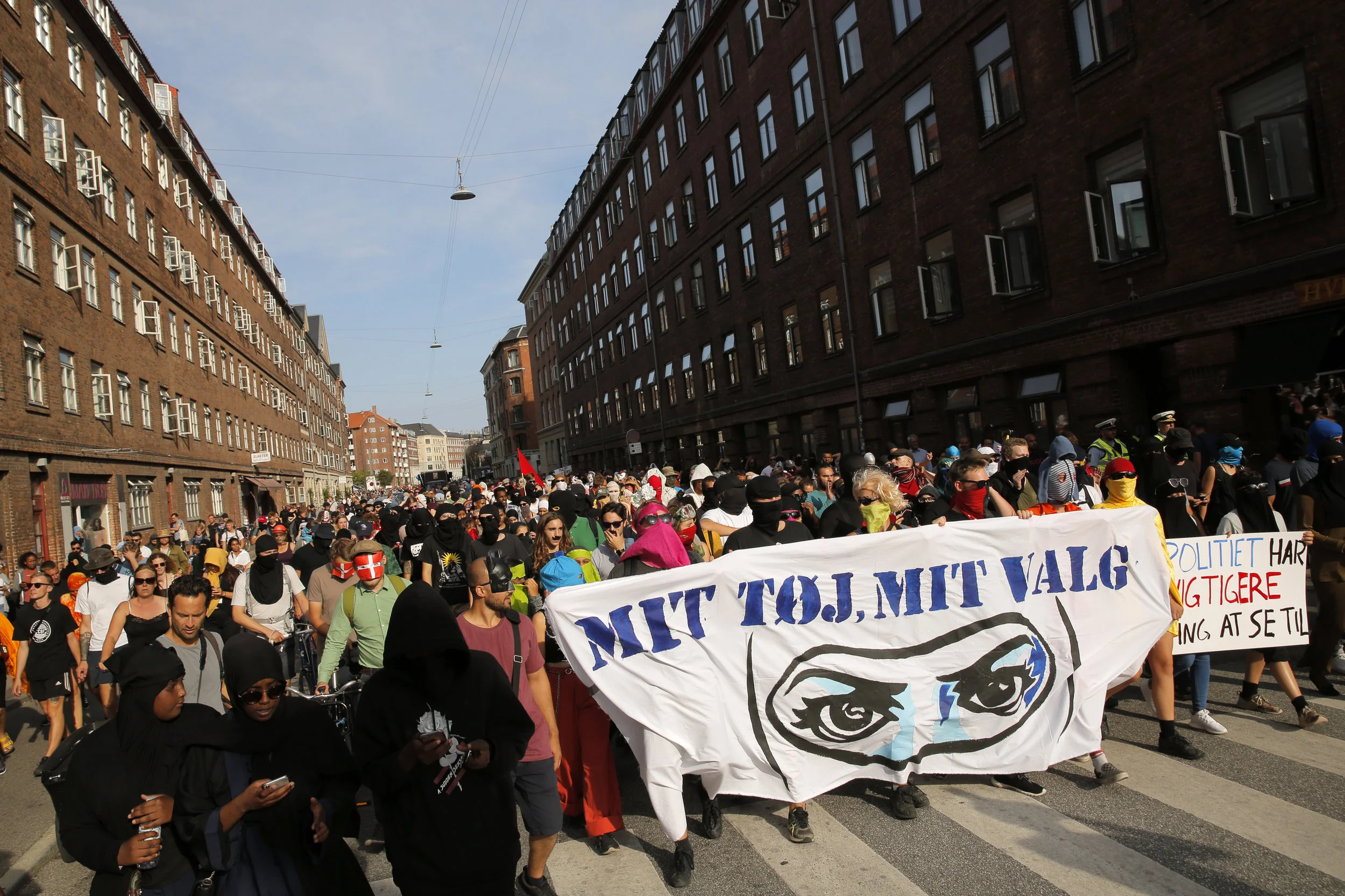  Protesters walk through the northern area of Copenhagen behind a banner stating “My clothes, my choice.” The protest was estimated to be attended by numbers as high as 900 and was made up of western and non-western Danes.  