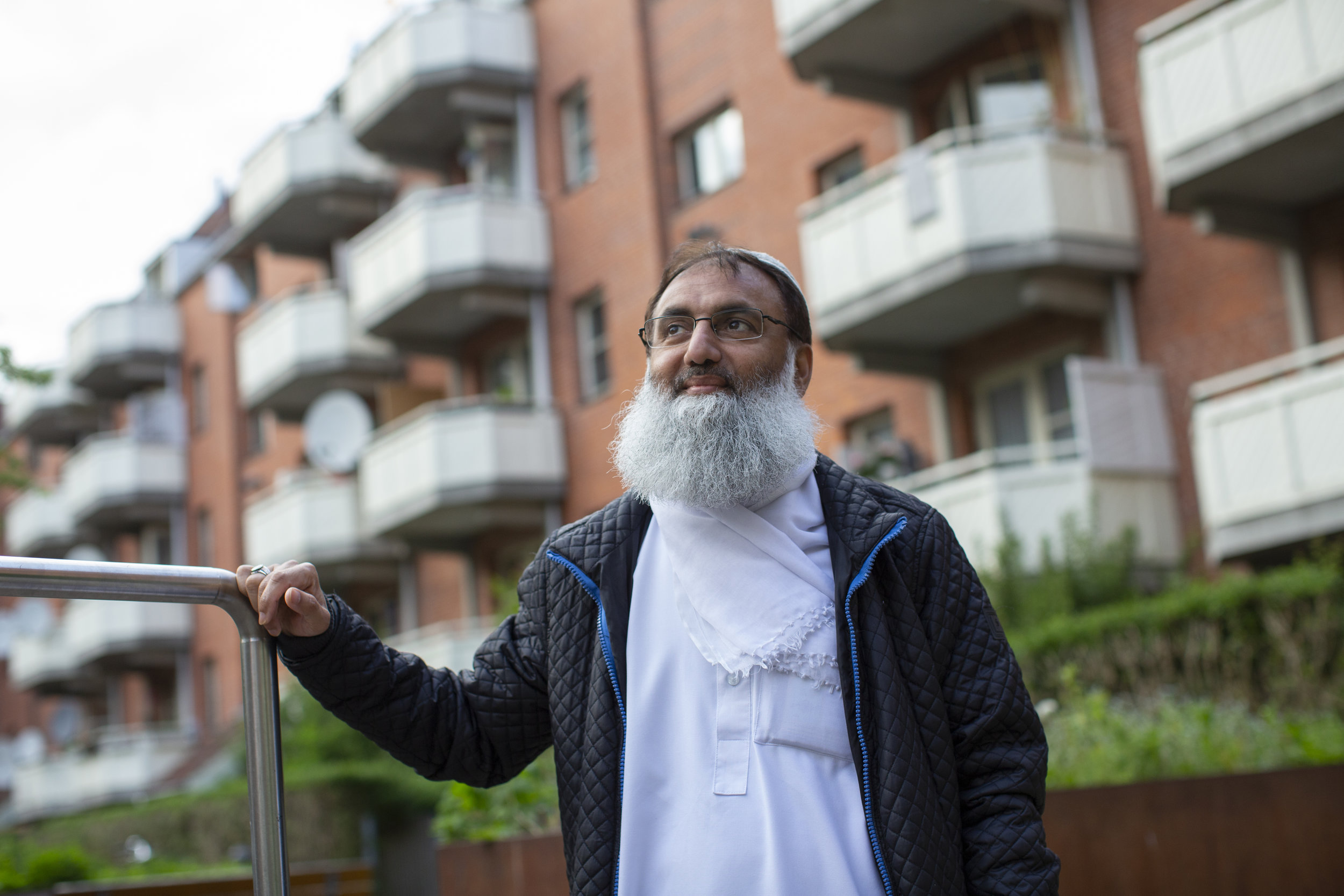 Mohammed Aslam, the chairperson of the Mjolnerparken’s residents association, stands in the courtyard by his apartment. Mr. Aslam is deeply concerned by the government labeling his neighborhood as a ghetto, feeling that it achieves only negative outcomes for Mjolnerparken’s residents.