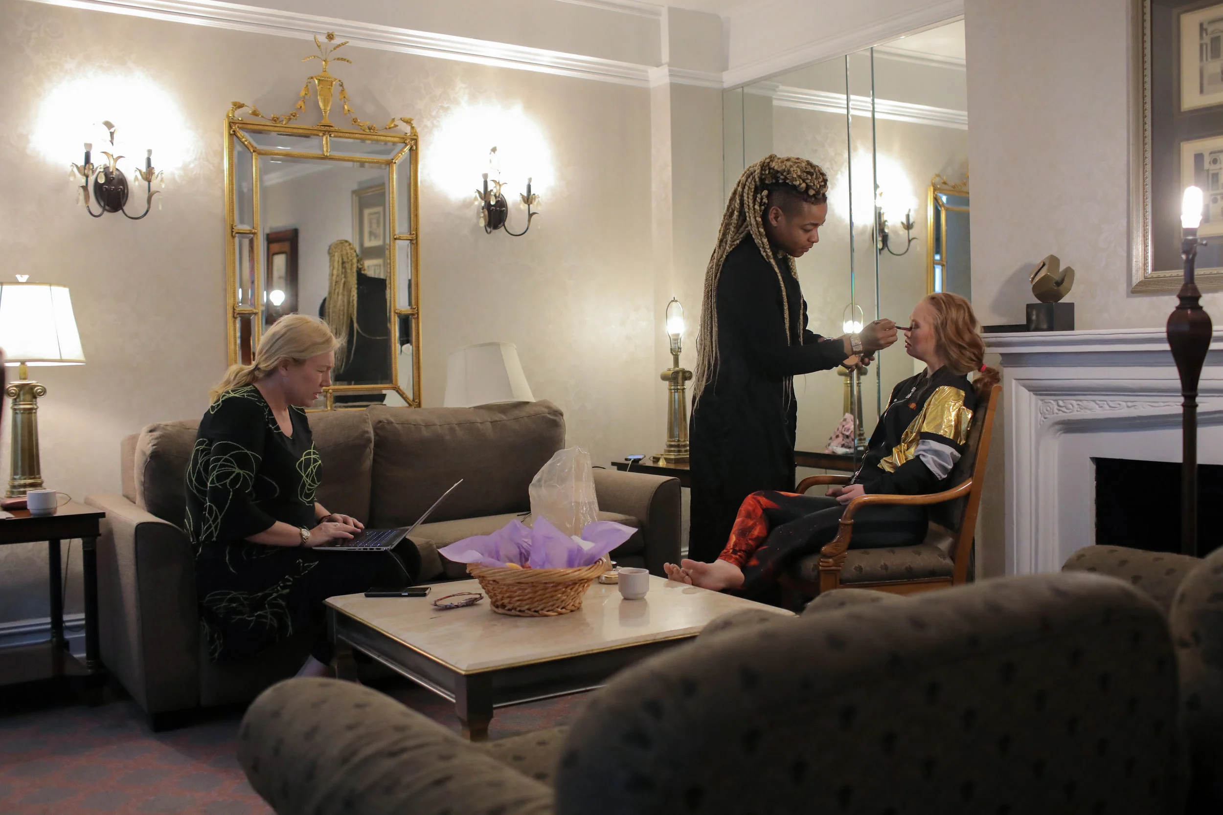  Rosanne Stuart, Madeline’s mother and manager, checks emails as Madeline is prepared to leave their hotel for the day. Rosanne manages both Madeline’s career and her own building surveying business that she operates in their native Australia. Throug