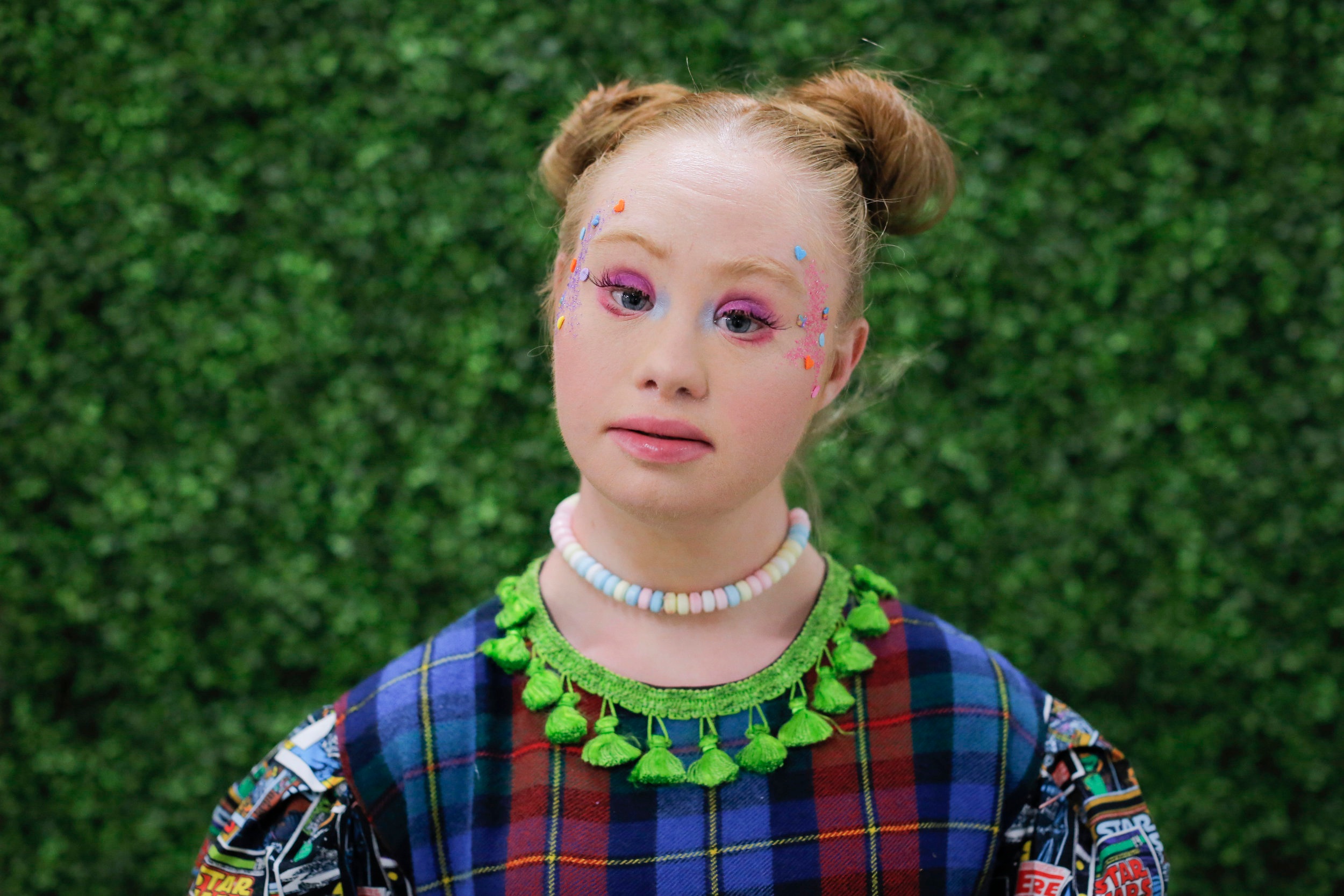  Madeline poses for a portrait before walking in the Burning Guitars presentation at New York Fashion Week. 