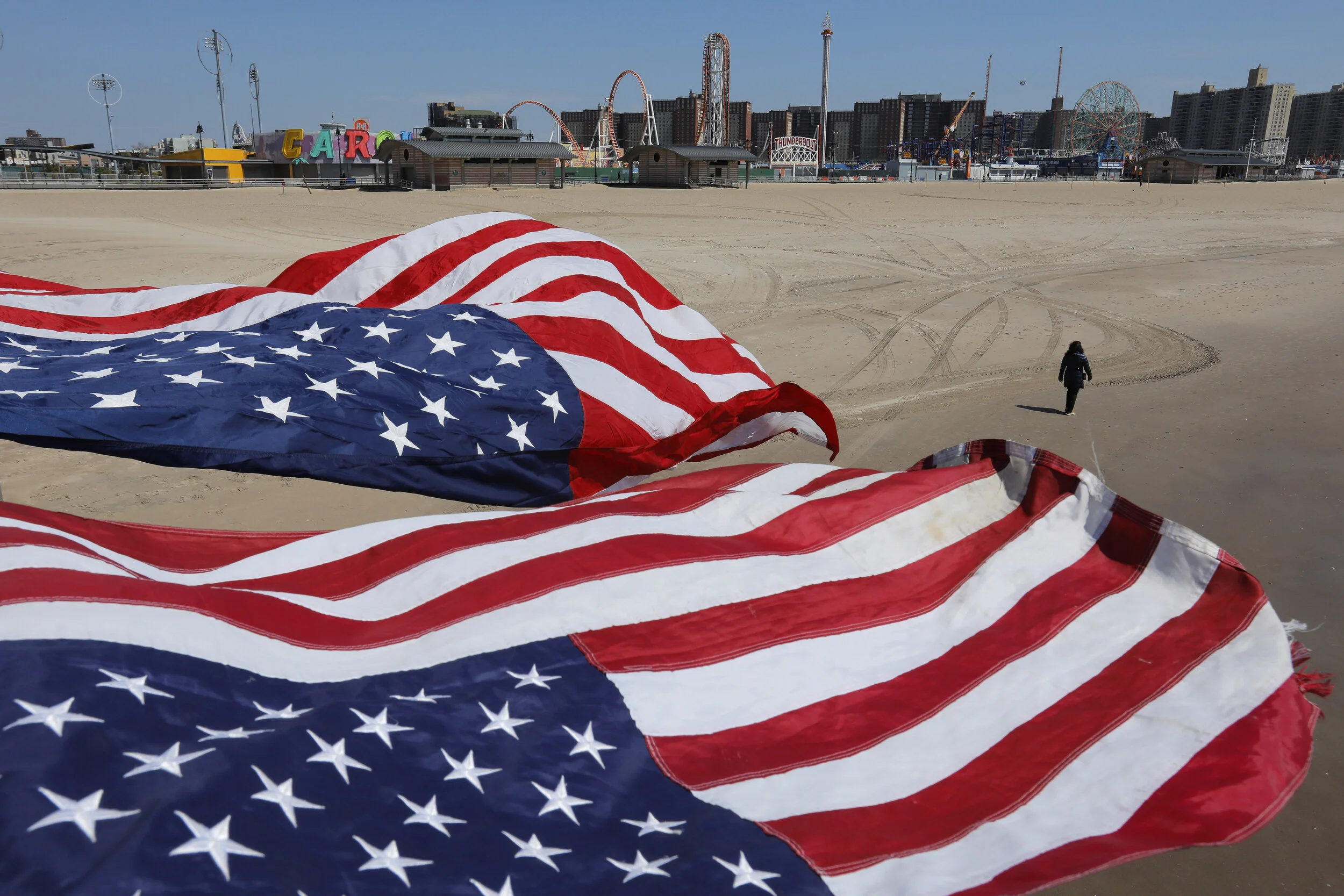  A person walks along a deserted Coney Island beach as the city lockdown saw popular public spaces all but completely devoid of people.  