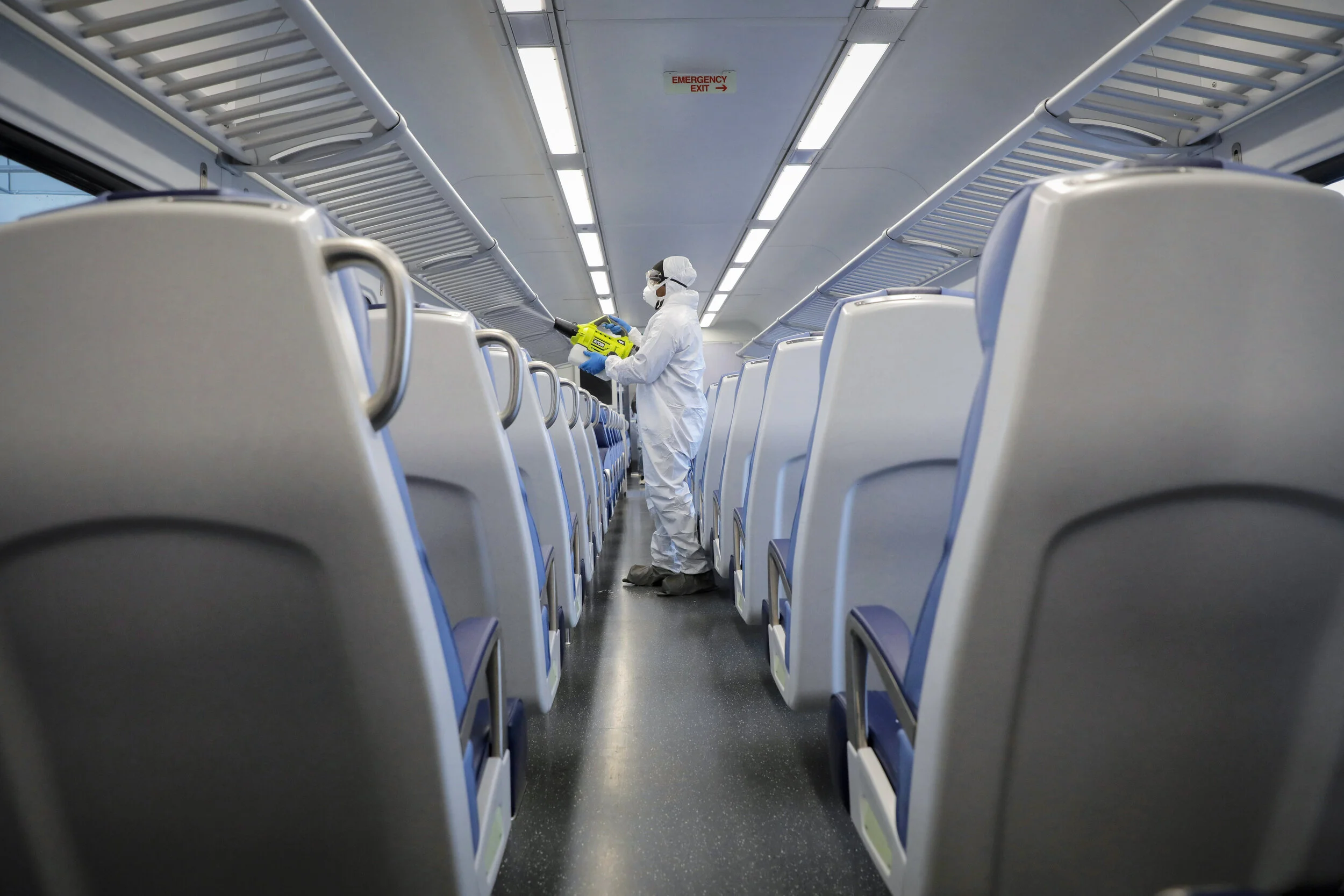  A worker disinfects a carriage on the Long Island Rail Road (LIRR) service at a station in Hicksville, New York. New York’s reliance on public transport services such as the LIRR and the New York City subway were cited as major contributors to the d