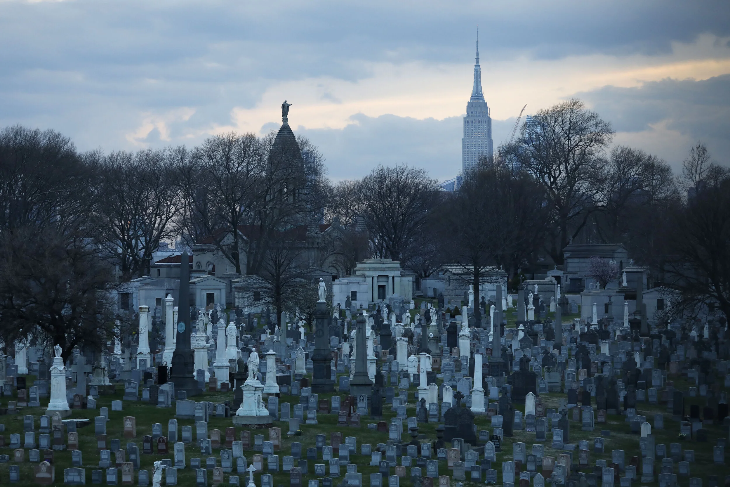  The Calvary Cemetery in Queens is seen empty against the backdrop of the Empire State Building.  As coronavirus took hold, cemeteries enforced strict regulations, opening only to limited visitors in an attempt to stop the spread of the disease.  