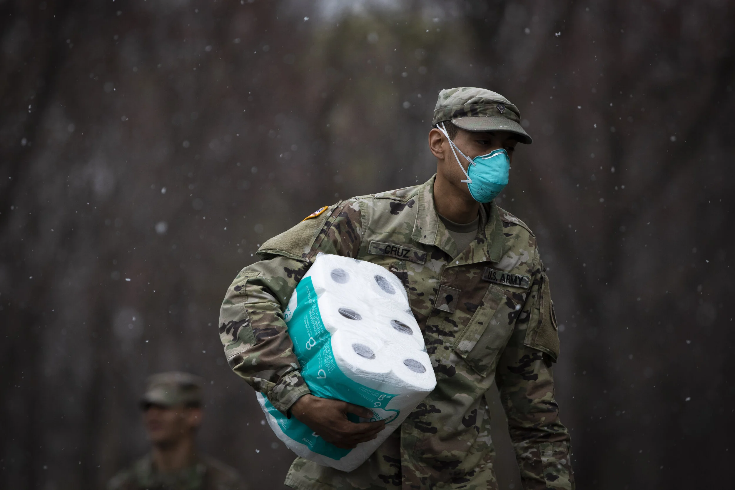  A member of the the New York National Guard clasps a pack of paper towel ahead of a disinfecting mission at Young Israel of New Rochelle synagogue. A member of the congregation tested positive for coronavirus on March 3, resulting in a shutdown of t