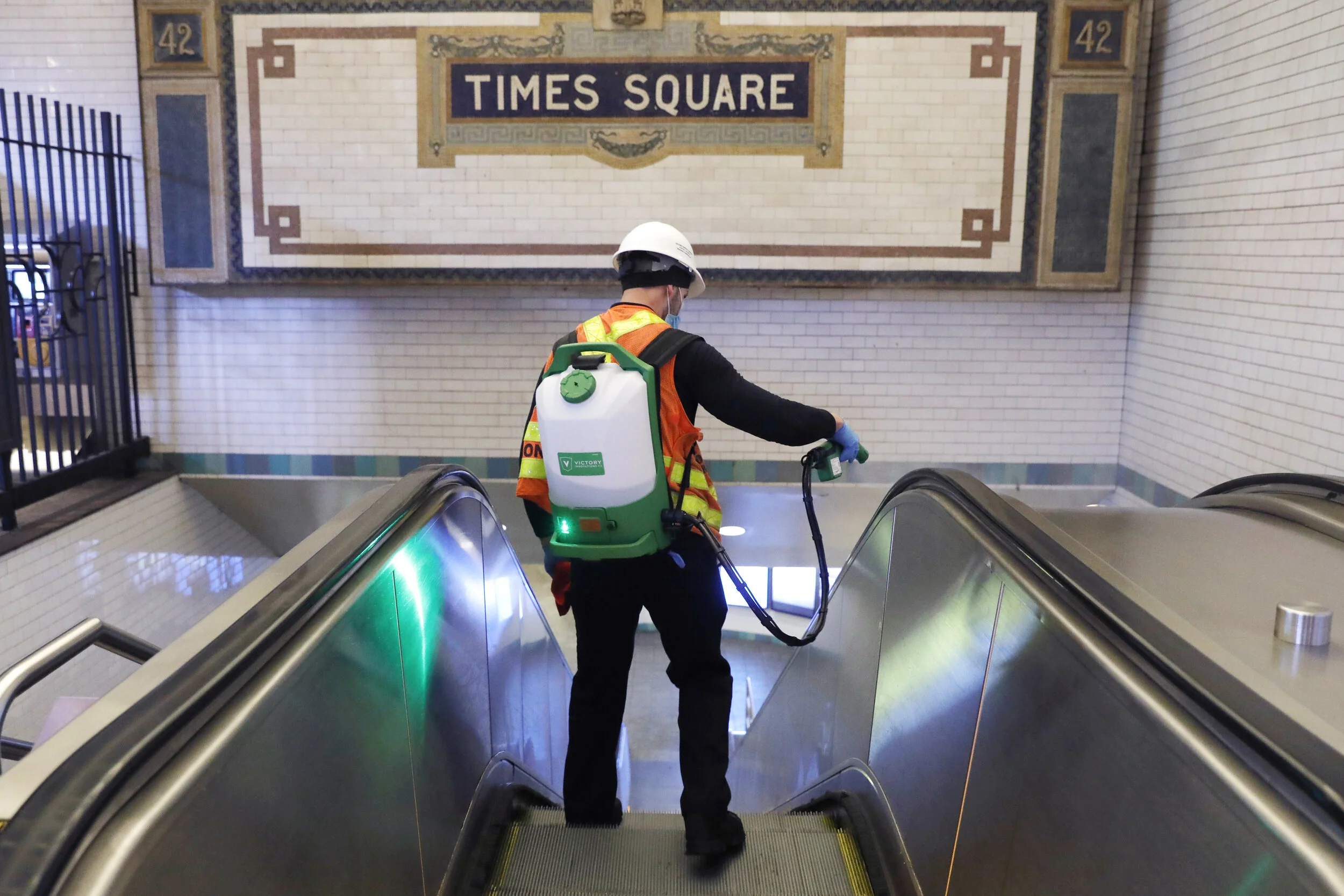  A contractor disinfects an escalator leading into the Times Square subway station. A decision was made to close the subway system down from 1:00 am to 5:00 am in order to conduct cleaning of stations and carriages to fight the spread of coronavirus.
