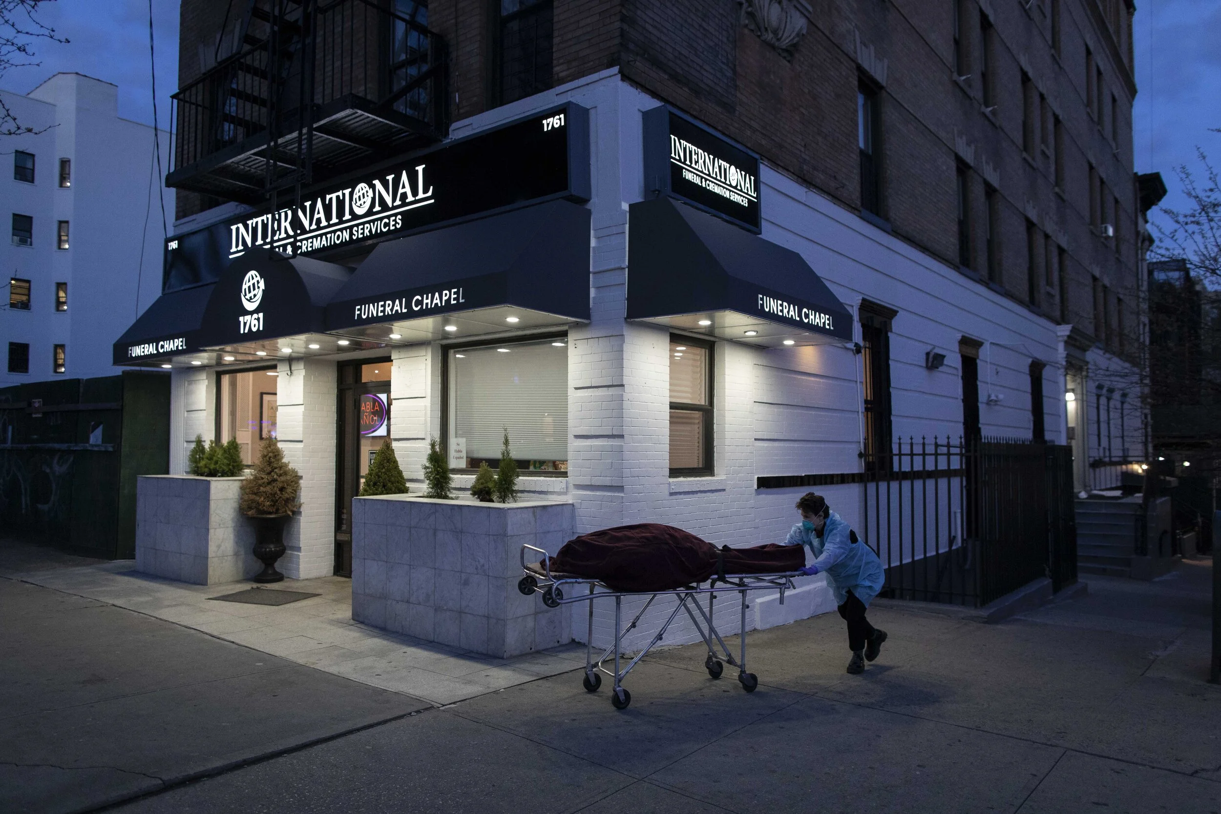  Lily Sage Weinreib wheels a body from the basement to the chapel to prepare for a viewing service the next day.  