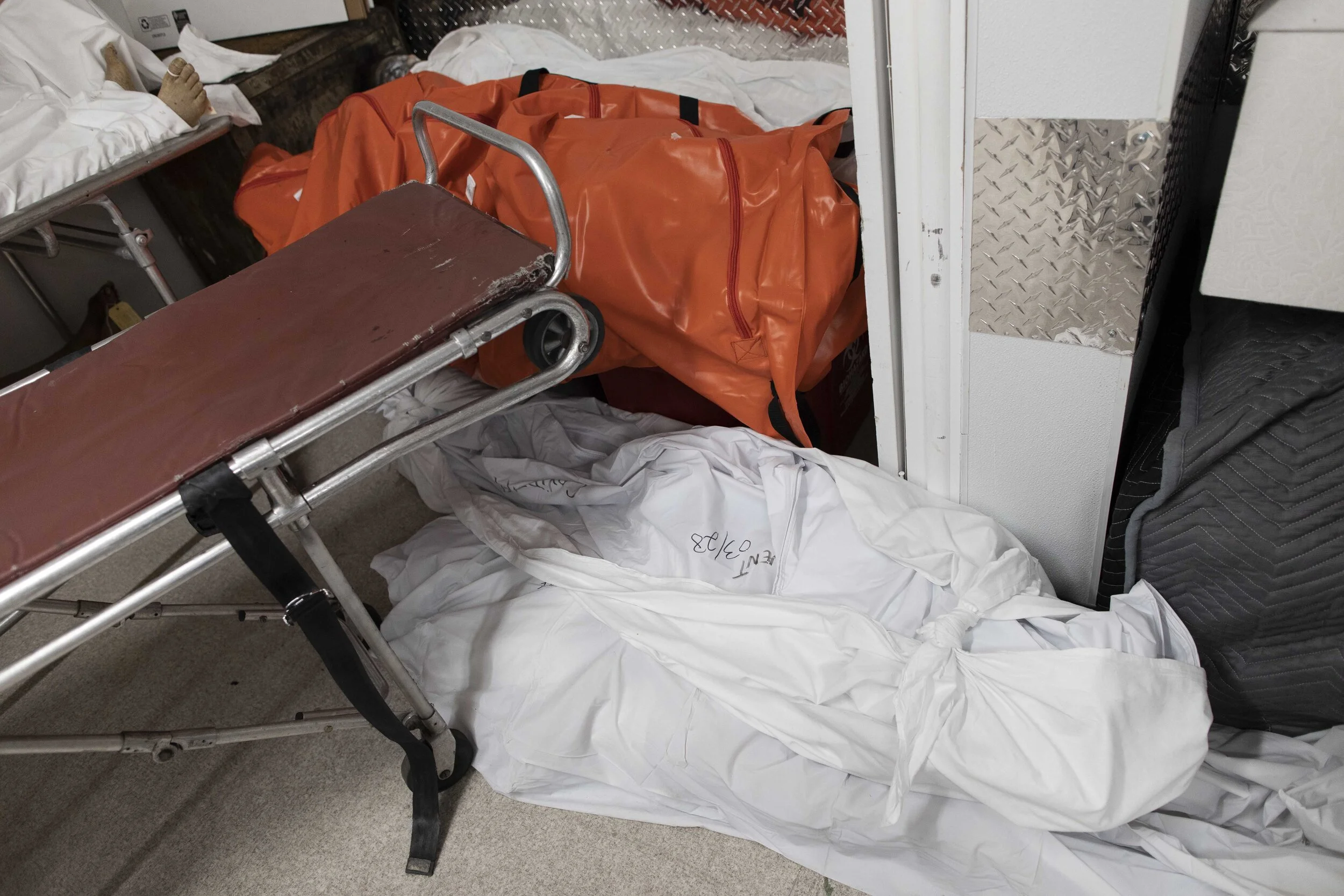  Bodies are laid in a corner as the basement, which typically holds around six bodies, held forty-eight during the peak of the pandemic.  