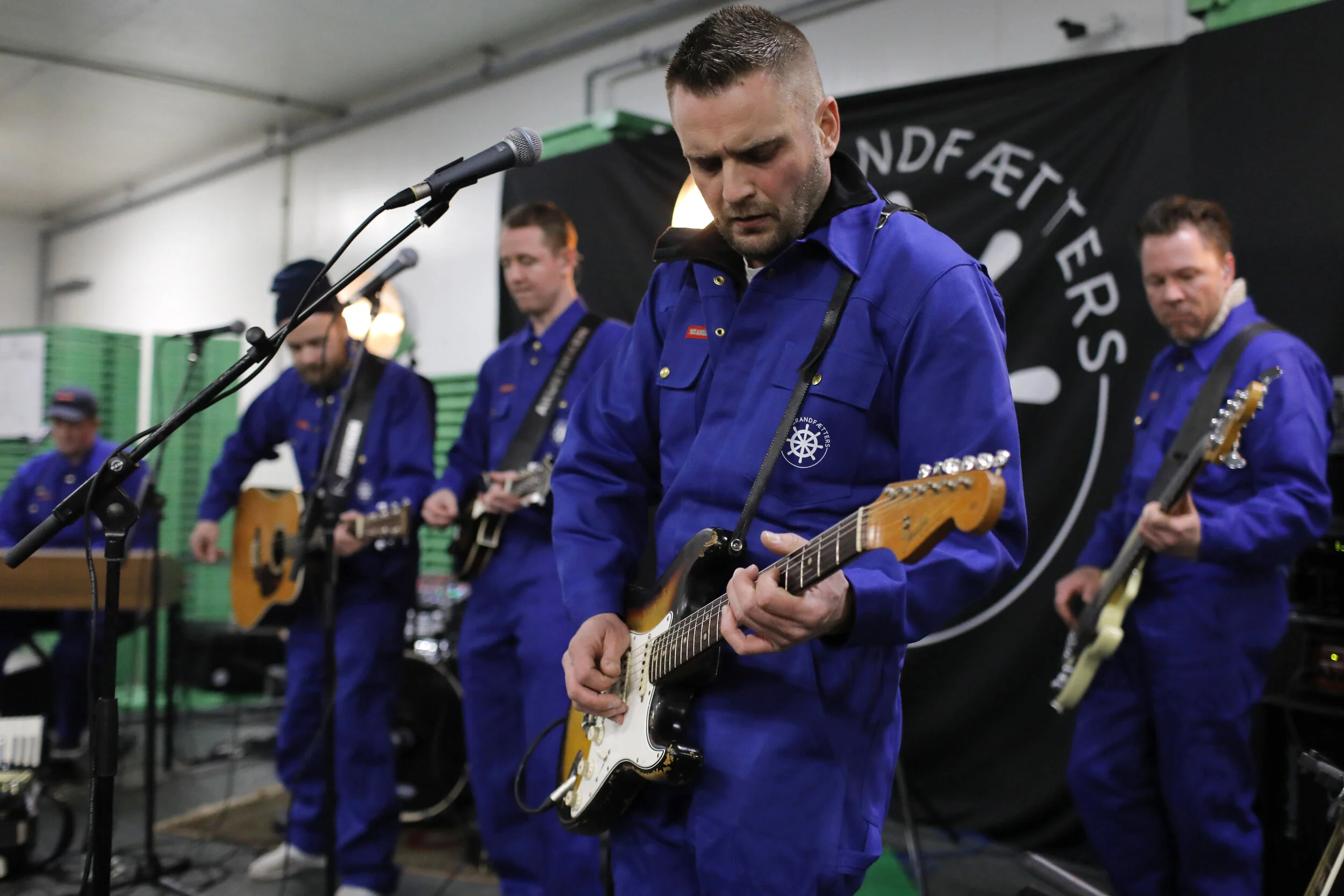  The Grandfætters, a local Thyborøn folk-rock band, play their album release party in a freezer store room at the Thyborøn fish auction center. The band paid homage to the fishing industry for their album release, playing a series of free shows in fi