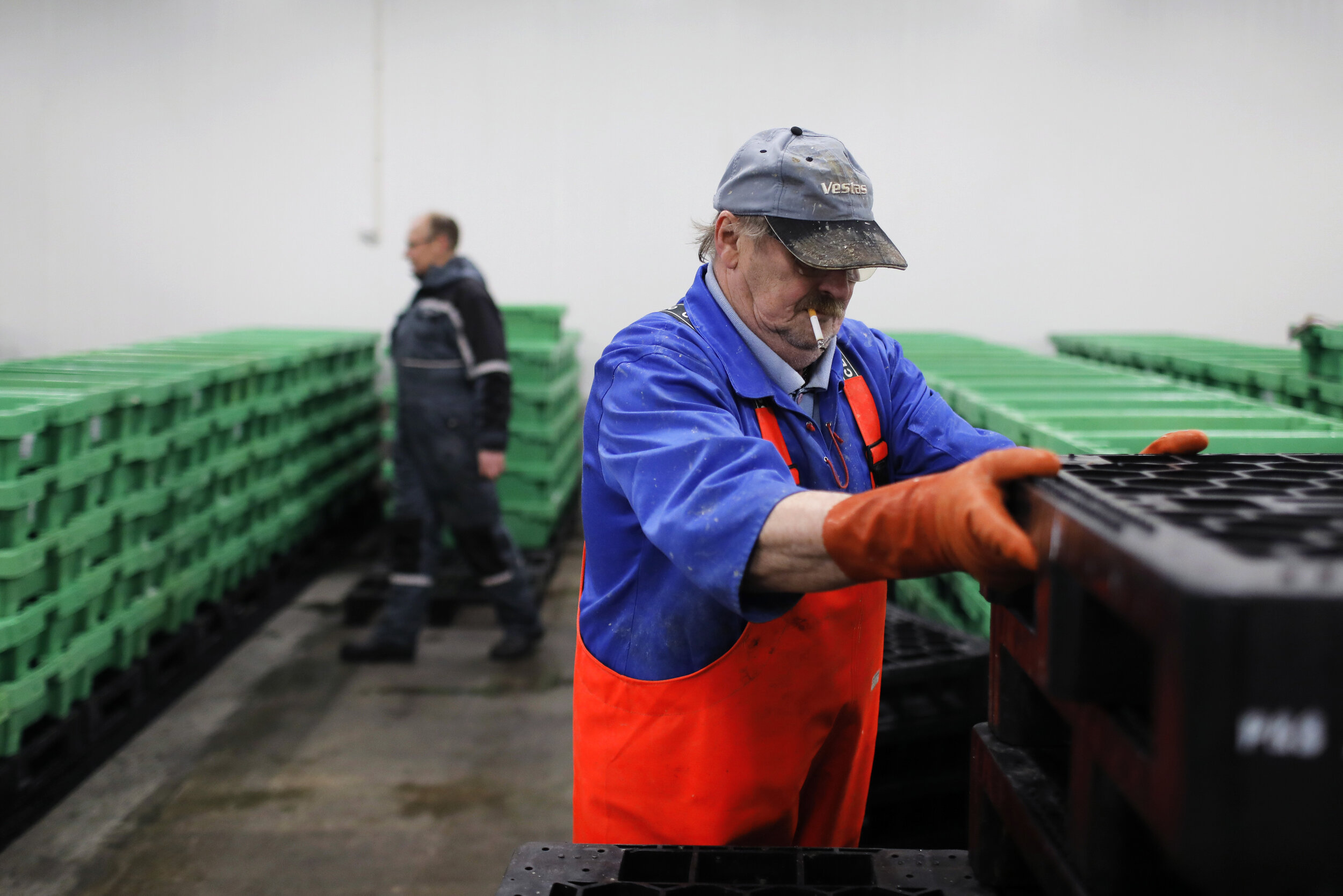  People gather in the Thyborøn fish auction house. The auctions now happen online from Monday to Friday from 6 AM.  