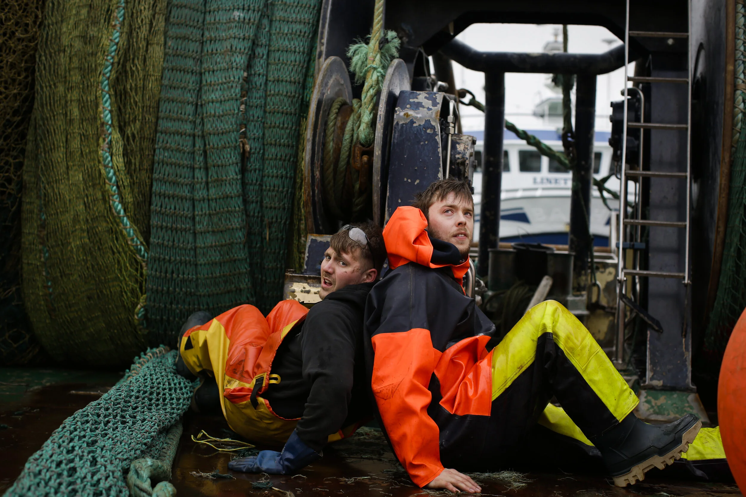  Fishermen Sebastian Pedersen and Rasmus Mathiesen roll up nets before embarking on a fishing trip aboard the ship Helgoland as it is docked in the village of Thyboron in Jutland, Denmark. 