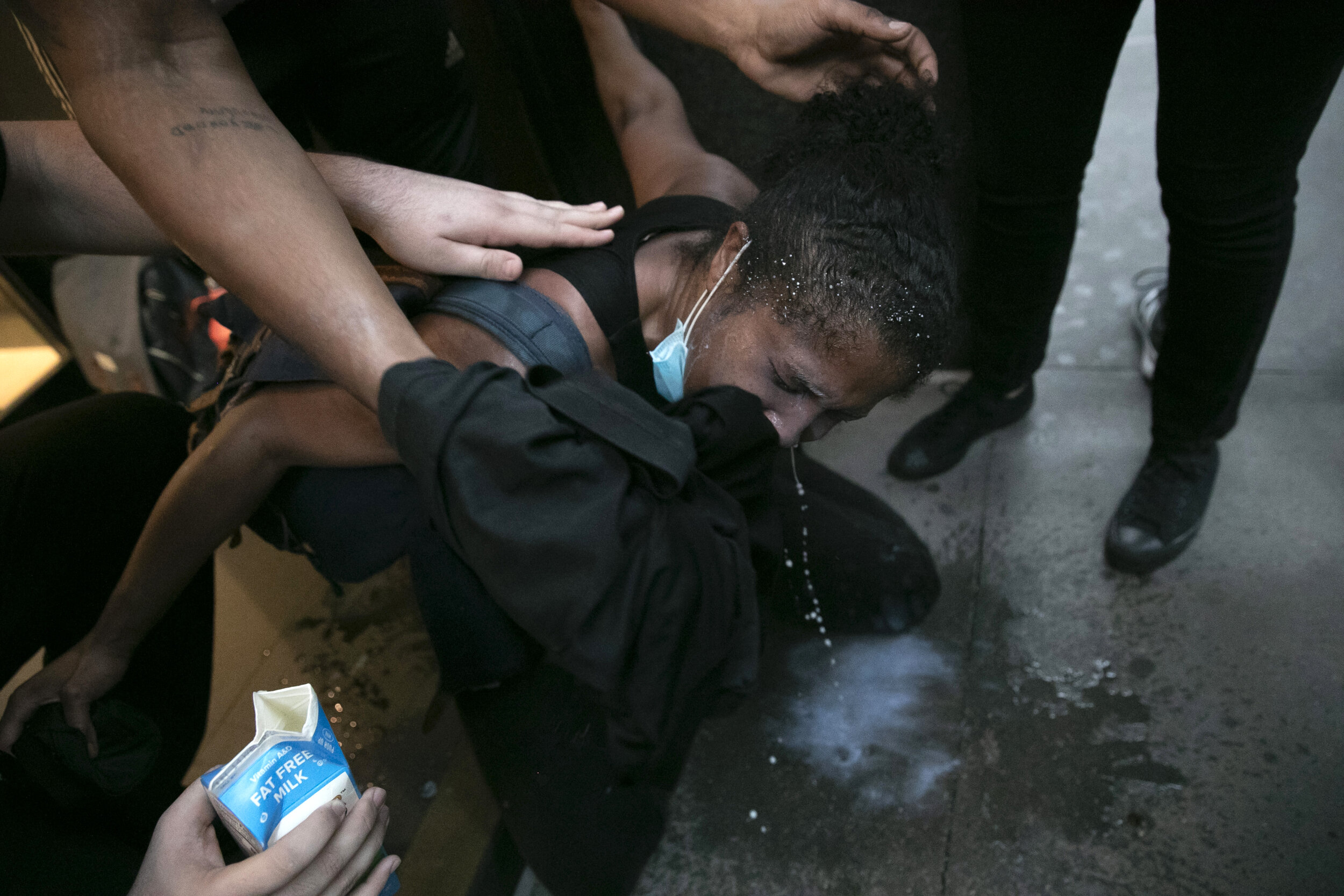  A protester is assisted after being pepper sprayed during a protest in Manhattan.  