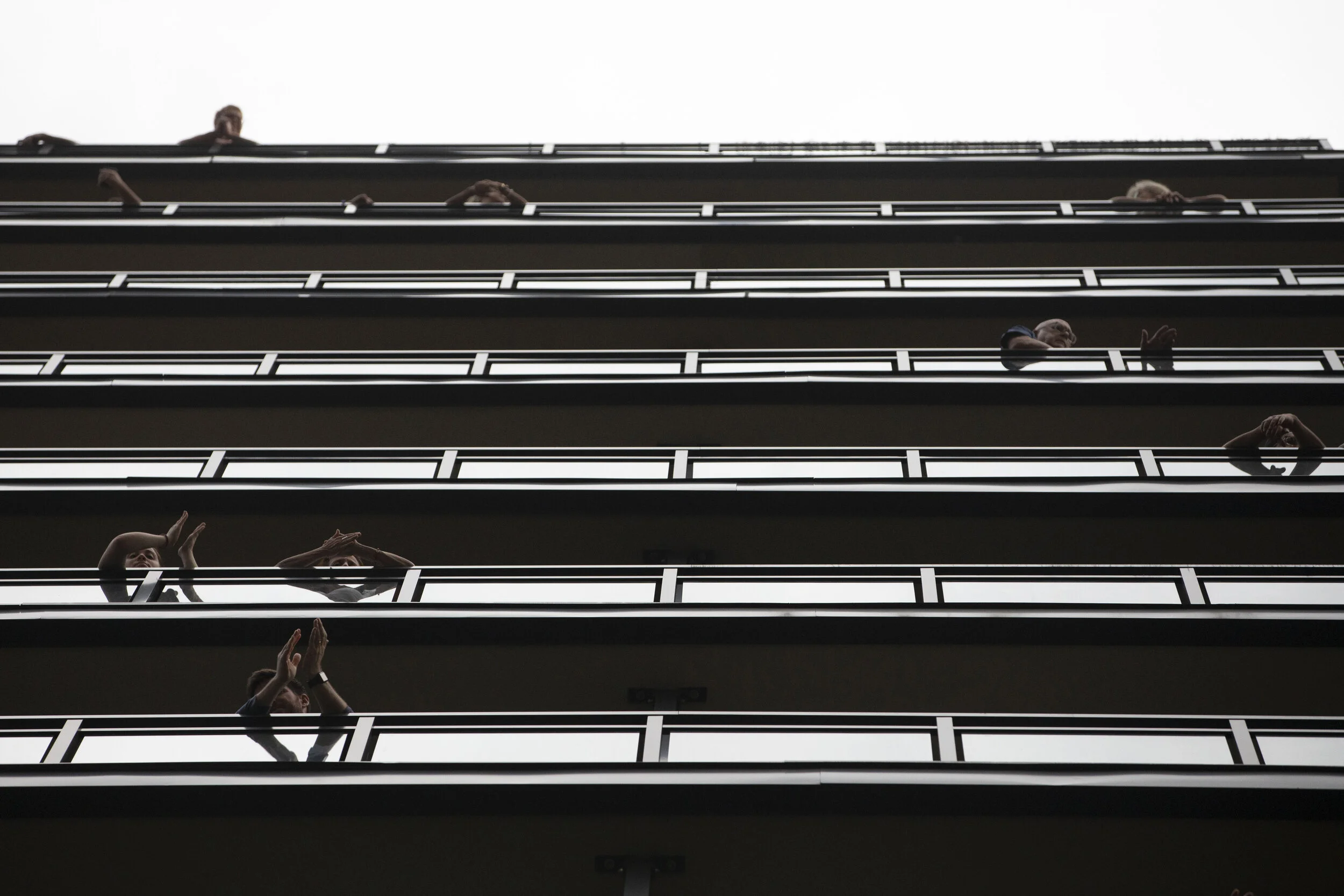  People watch from balconies as protesters make their way through Manhattan’s Upper East Side.  