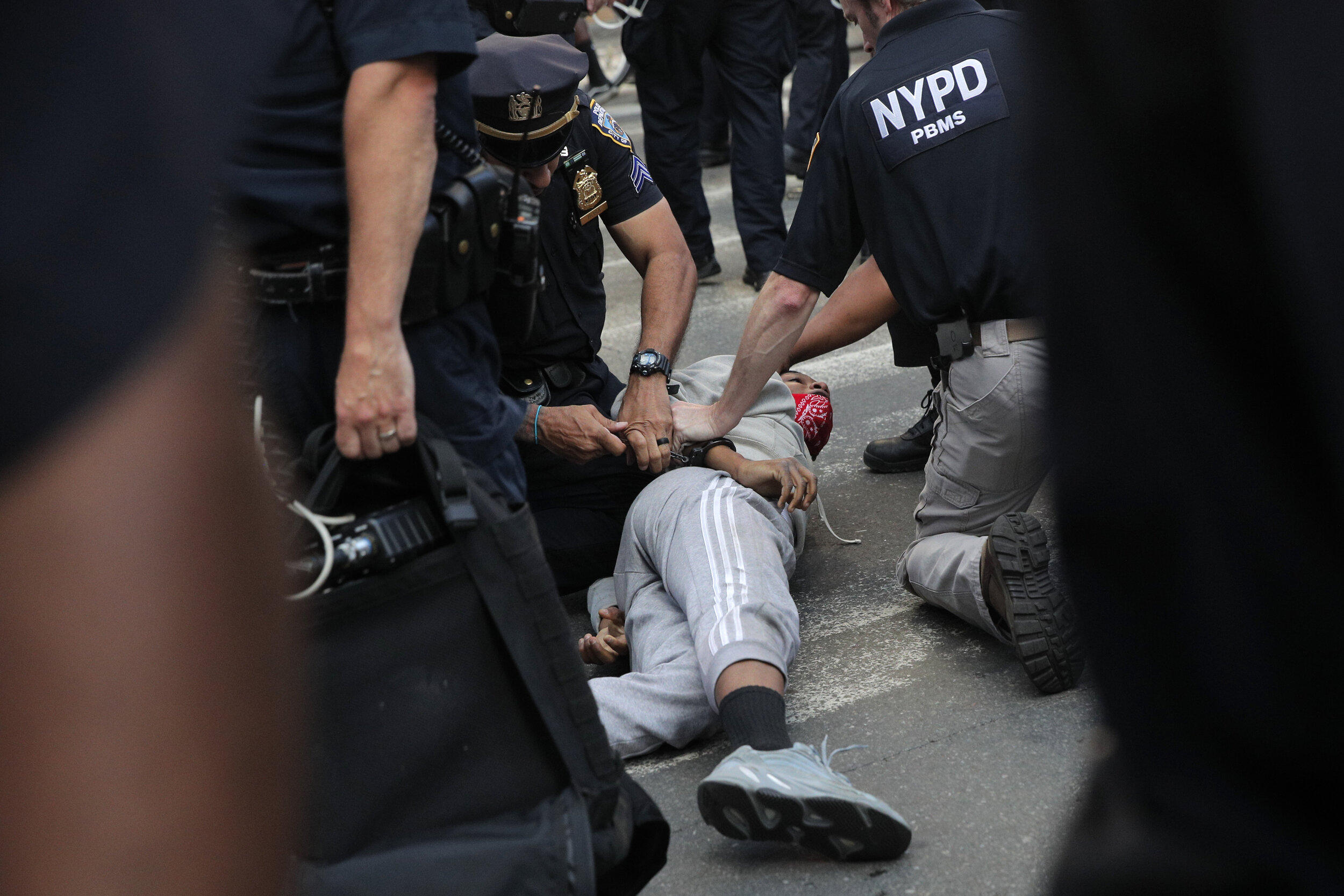  A protester is detained during a demonstration in Times Square, New York City 