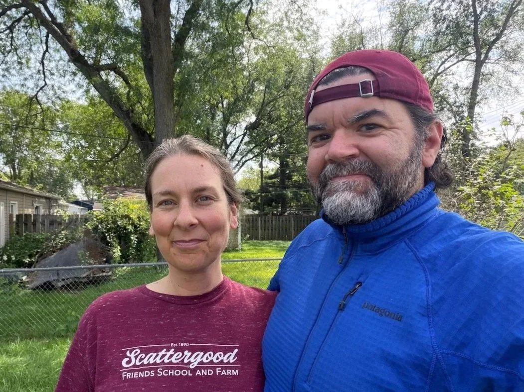 Laura Bergus and Nick Bergus pose for a selfie outdoors.