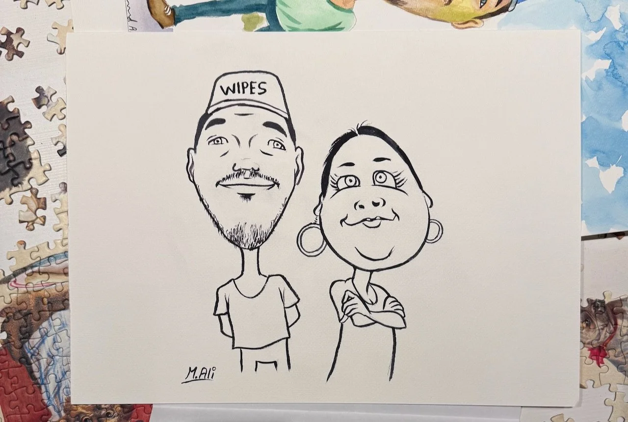 A caricature sketch of Oliver and Laura on a background of puzzle pieces.