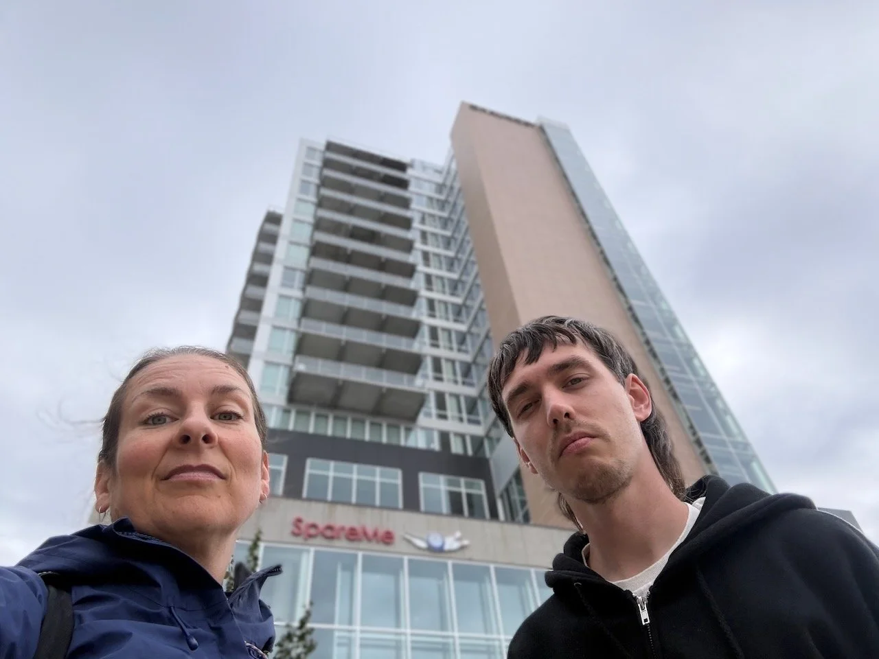 Laura Bergus and Oliver Weilein pose in front of The Chauncey building at 404 E. College Street in Iowa City.