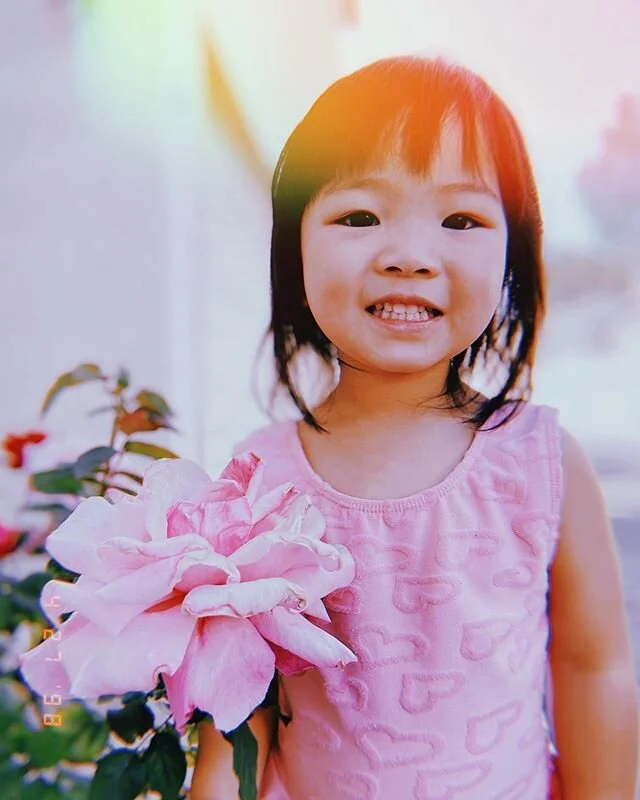 She wanted to take a picture of the flower cause it matched her dress ... #Evangelinejoykuo
