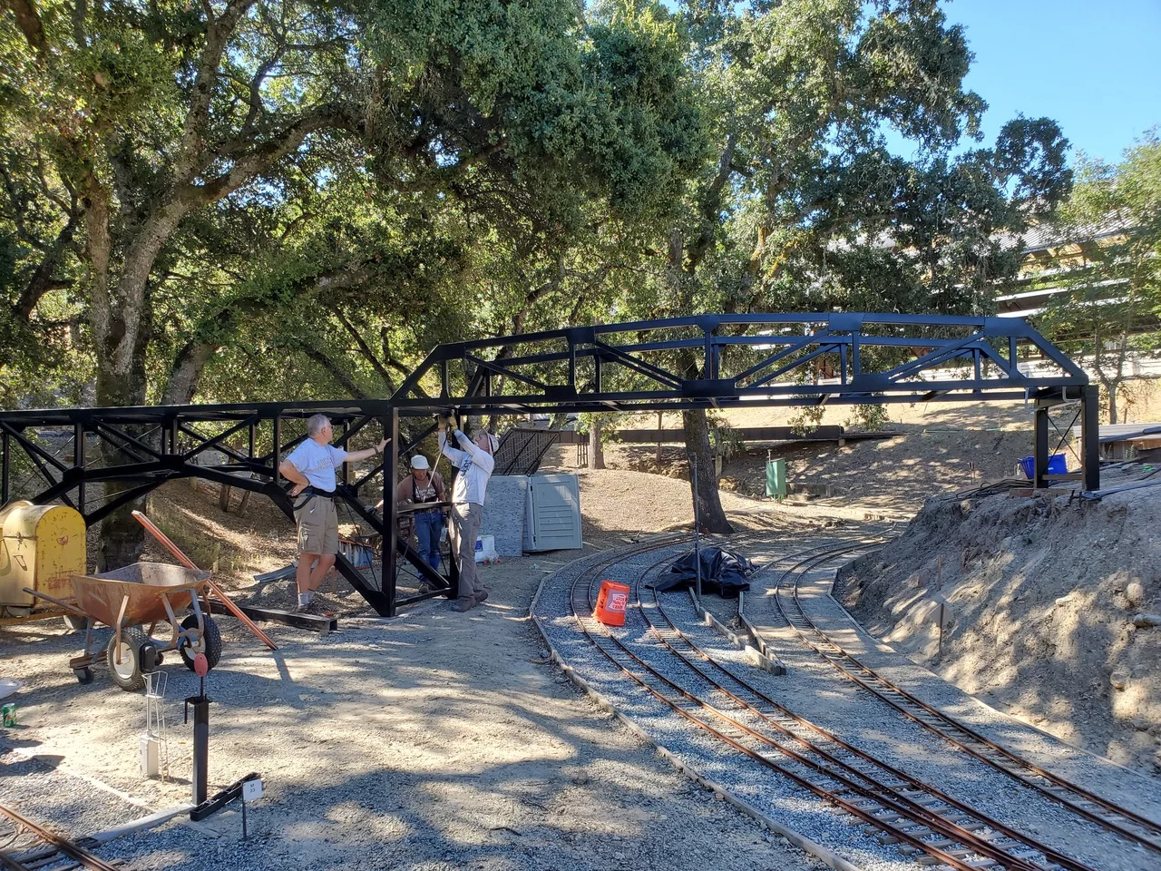 Bridge was set on bent and rails were removed. Bruce is tightening the bolts attaching the bridges together while Russ   single  -  handedly   holds the whole thing up.