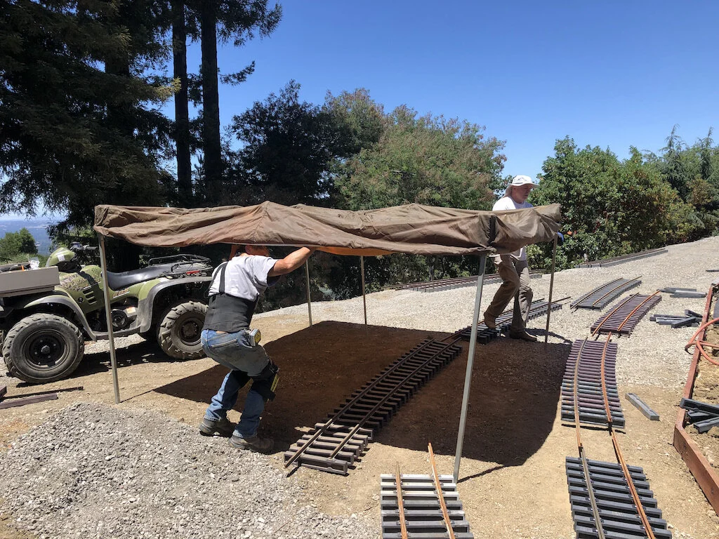 Erecting a popup tent as we exit the tunnel into the sun