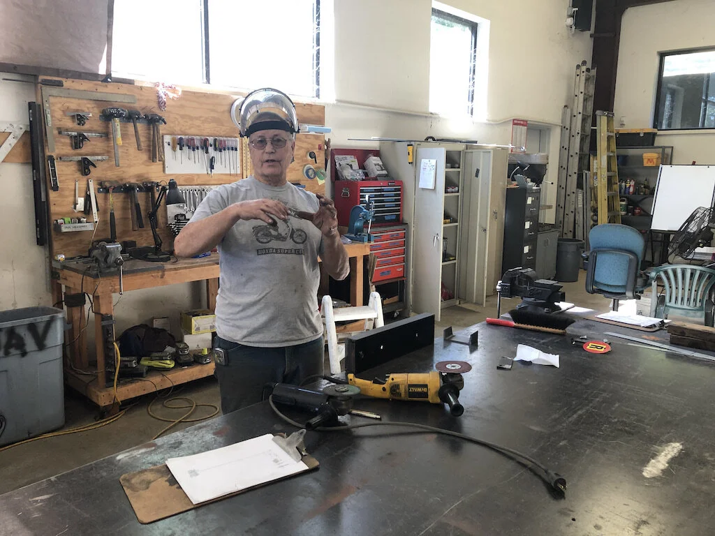 Tom working on a special case remote switch stand  for use by the end of the lake by the Purina grain building