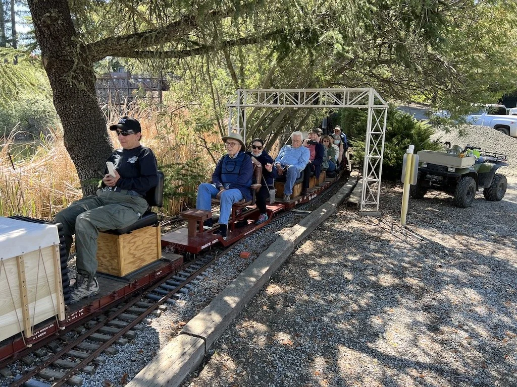 Ron enjoys a ride on Bruce’s special passenger car