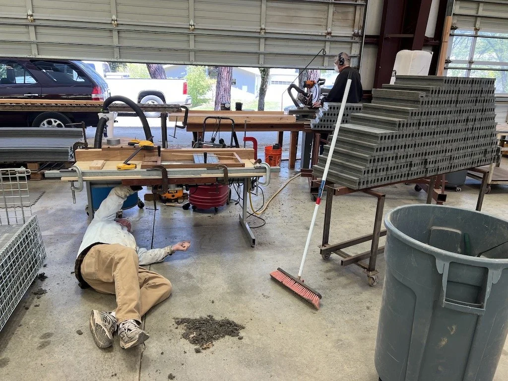 Mike adjusts the vacuum system to capture more plastic chips