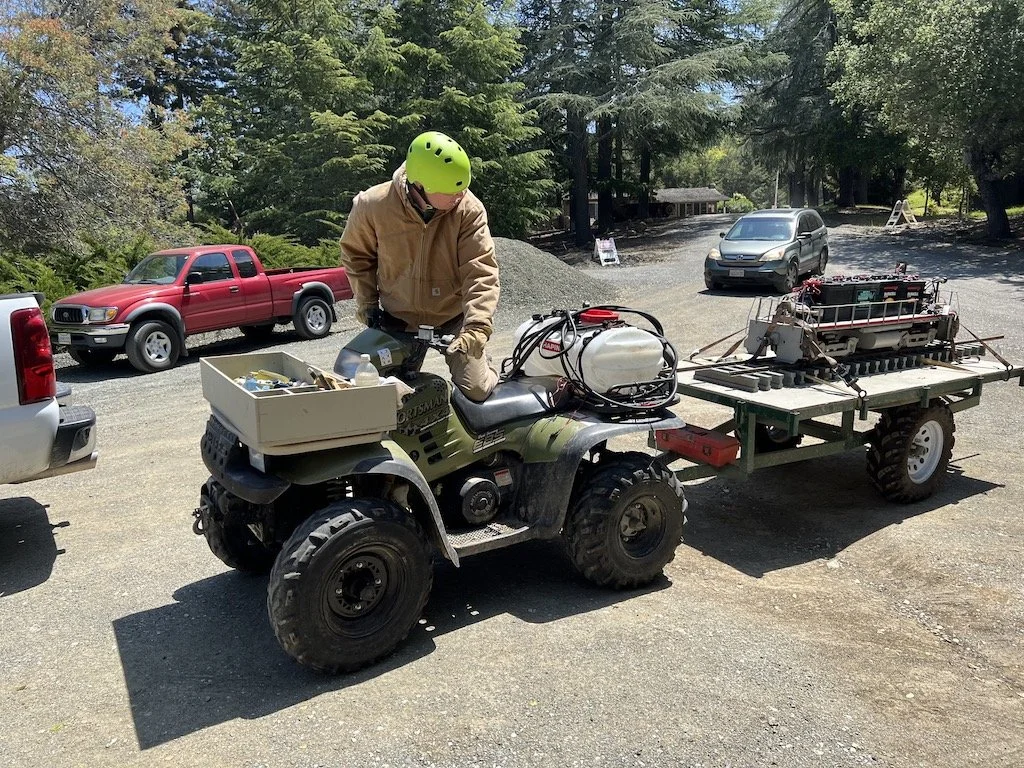 Bruce transports Matt’s engine from the shop to the station area