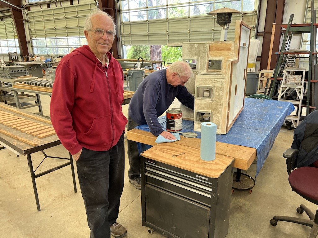 Lance admires Ron’s handiwork on little buildings
