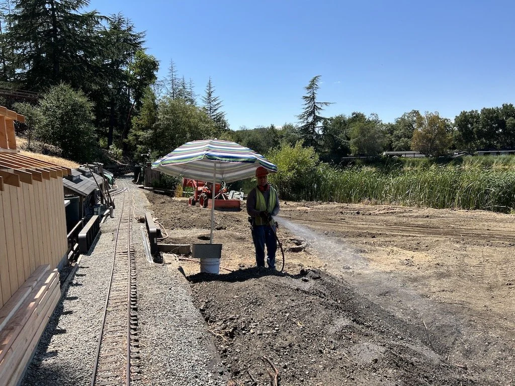 Wetting the loose dirt to be compacted next week