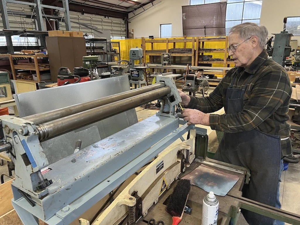 Tom calibrates the metal roller that Ken loaned us