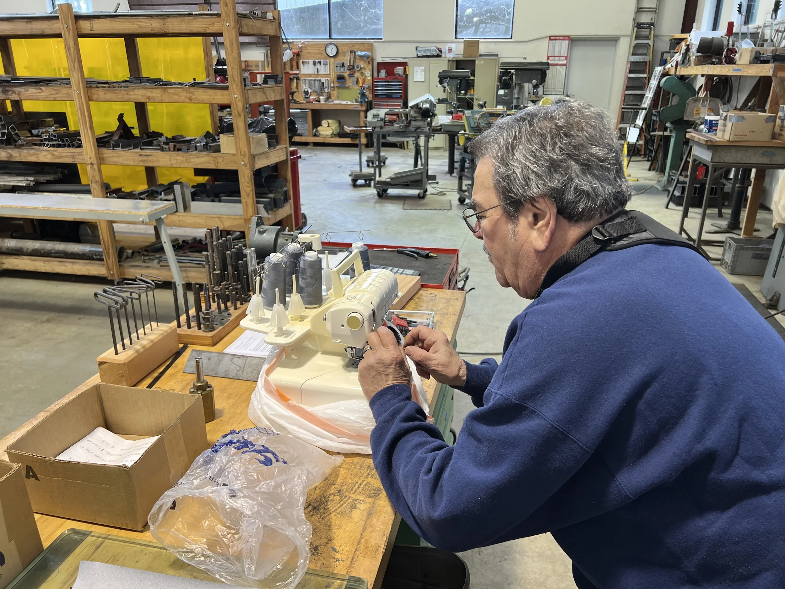 Carl performs a quick repair on a sewing machine for Bob’s wife