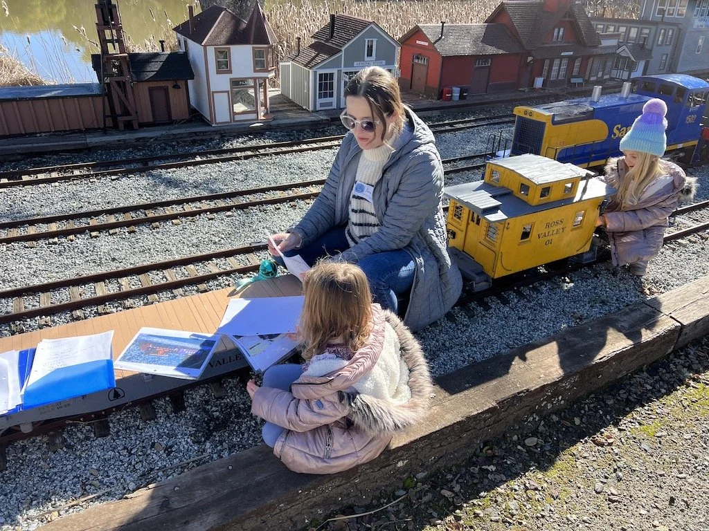 A flat car is as good a place as any to practice your letters and drawing skills