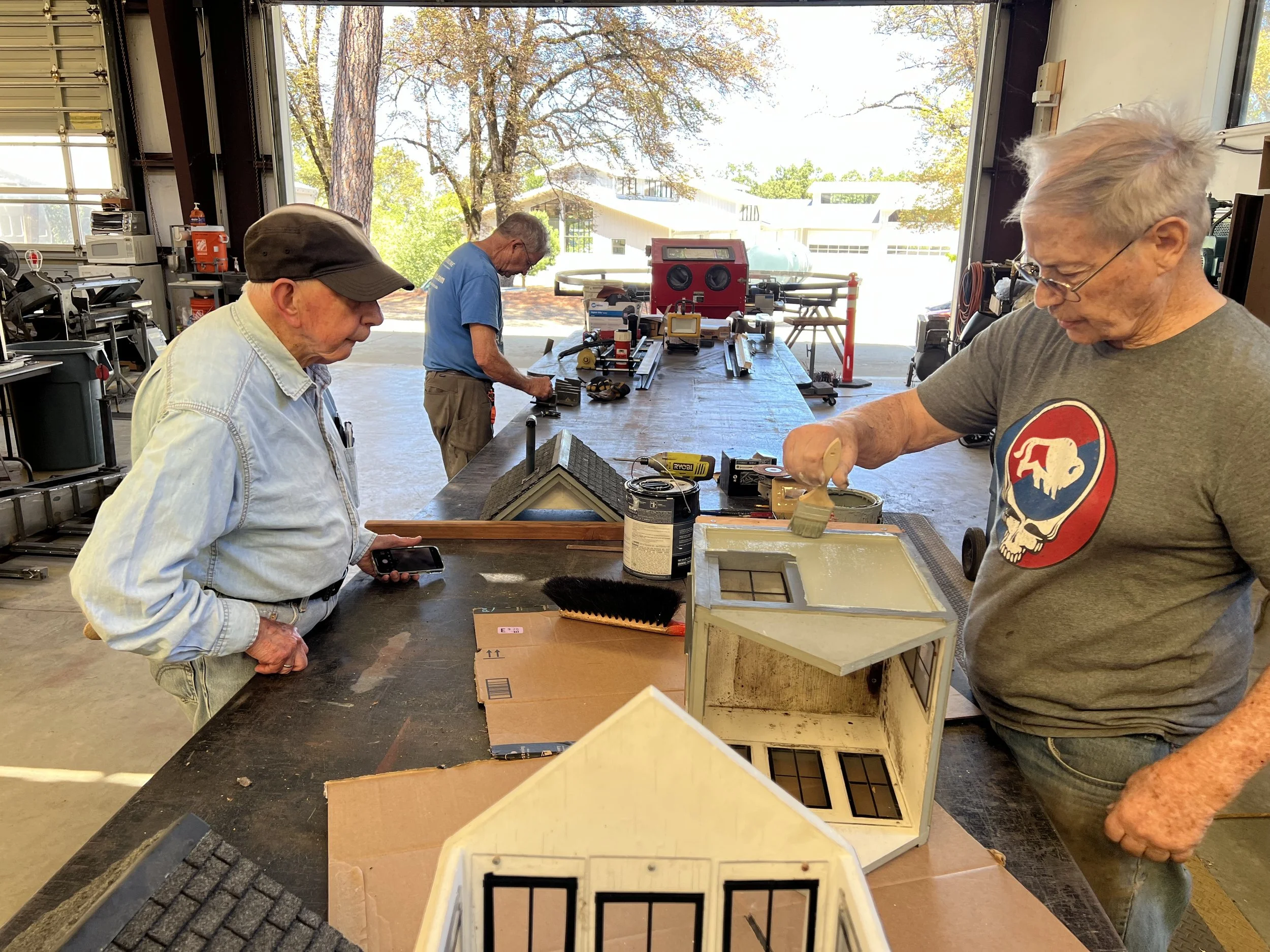Tom was painting little buildings today