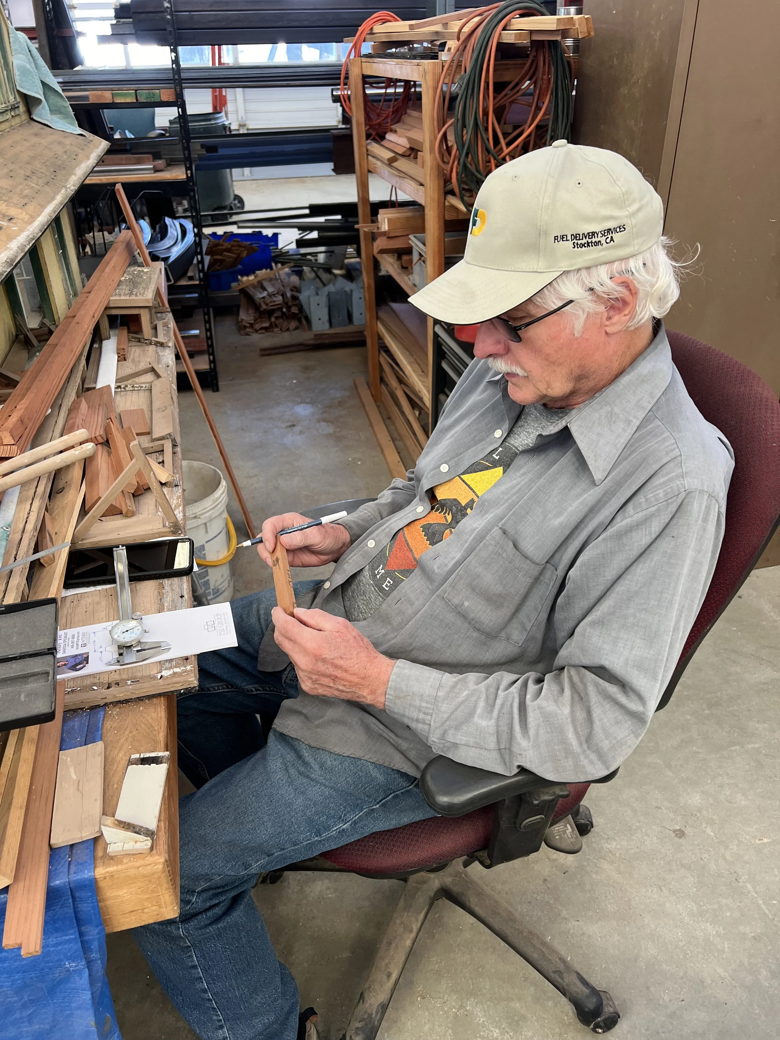 Randy sketching out parts for a little building's roof