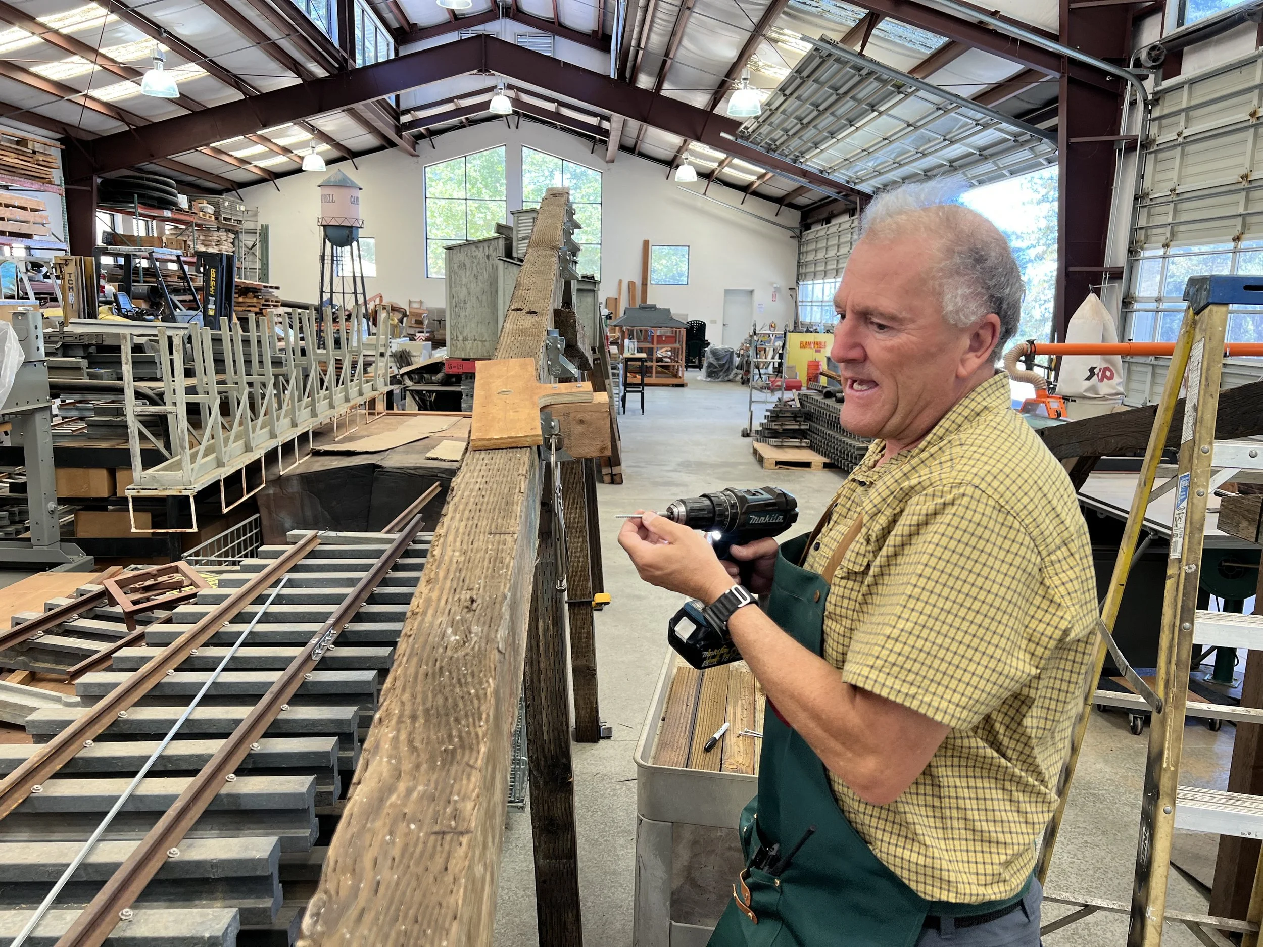 Robert installs joist hangers which is much easier done in the shop than