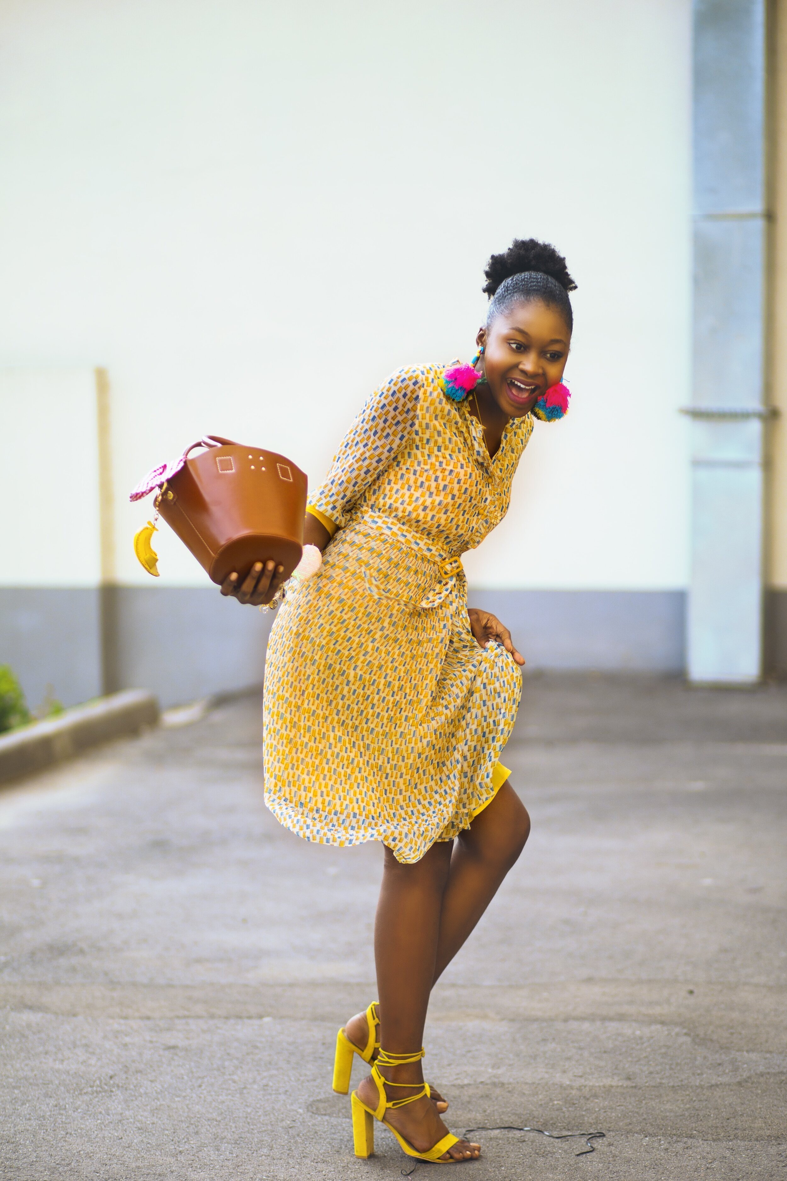 woman-in-pink-dress-holding-brown-bag-standing-1416377.jpg