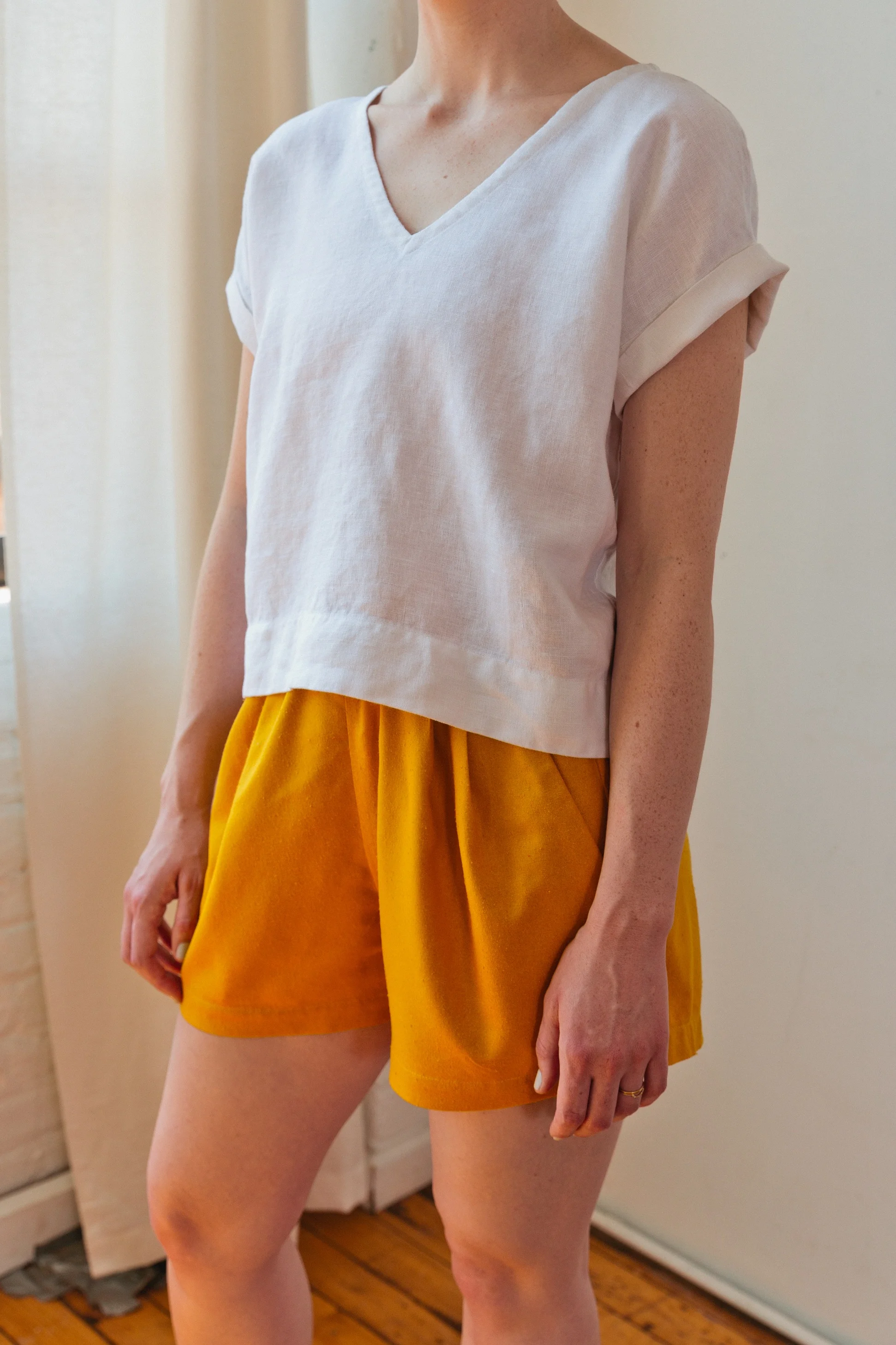 Puff Shorts in gold raw silk and Cuff Tee in white linen